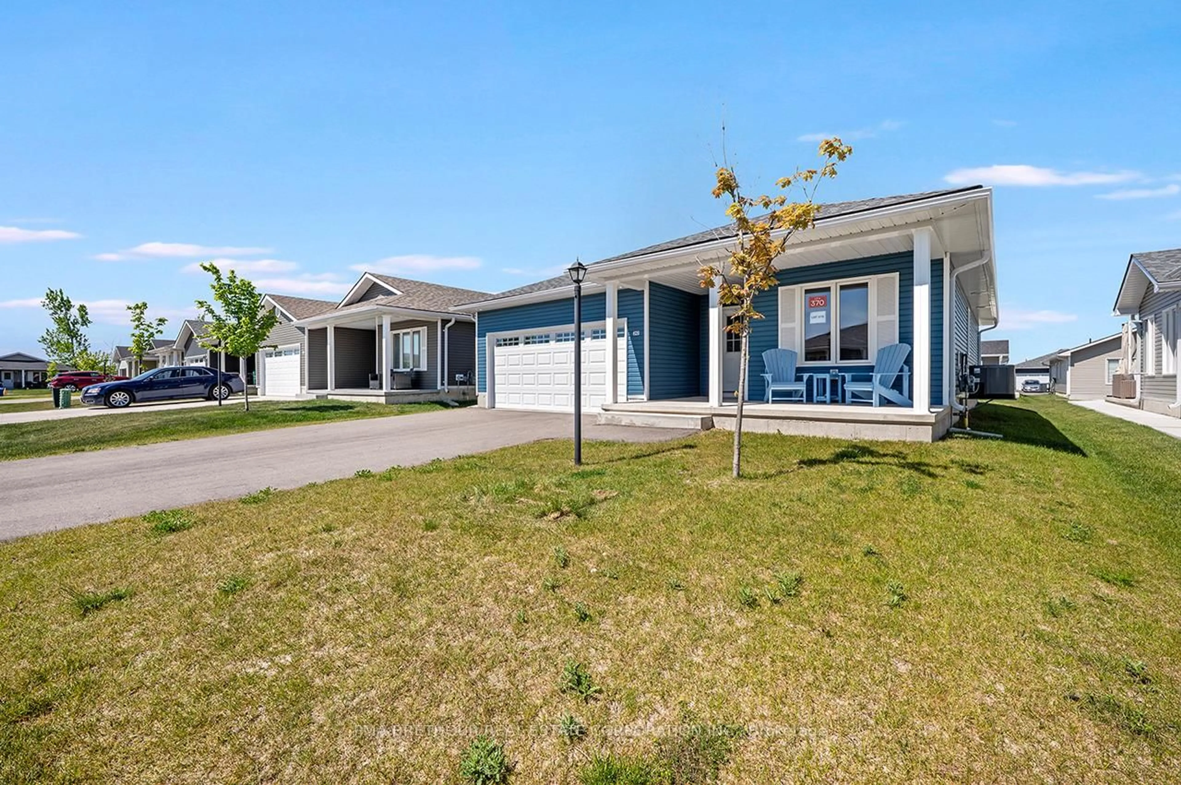 Home with vinyl exterior material, street for 242 Lake Breeze Dr, Ashfield-Colborne-Wawanosh Ontario N7A 0C6