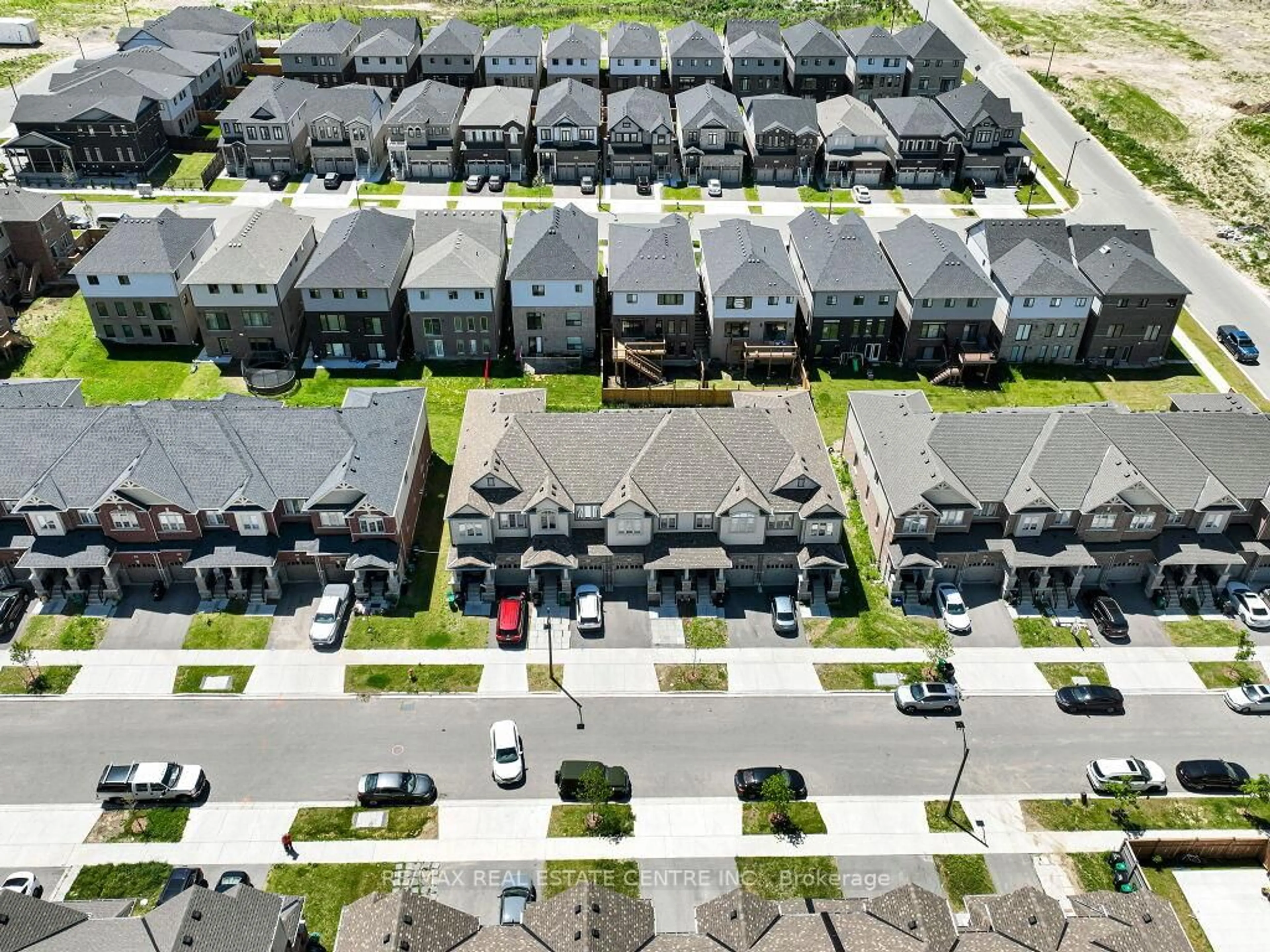 A pic from outside/outdoor area/front of a property/back of a property/a pic from drone, street for 76 Grassbourne Ave, Kitchener Ontario N2R 0S5