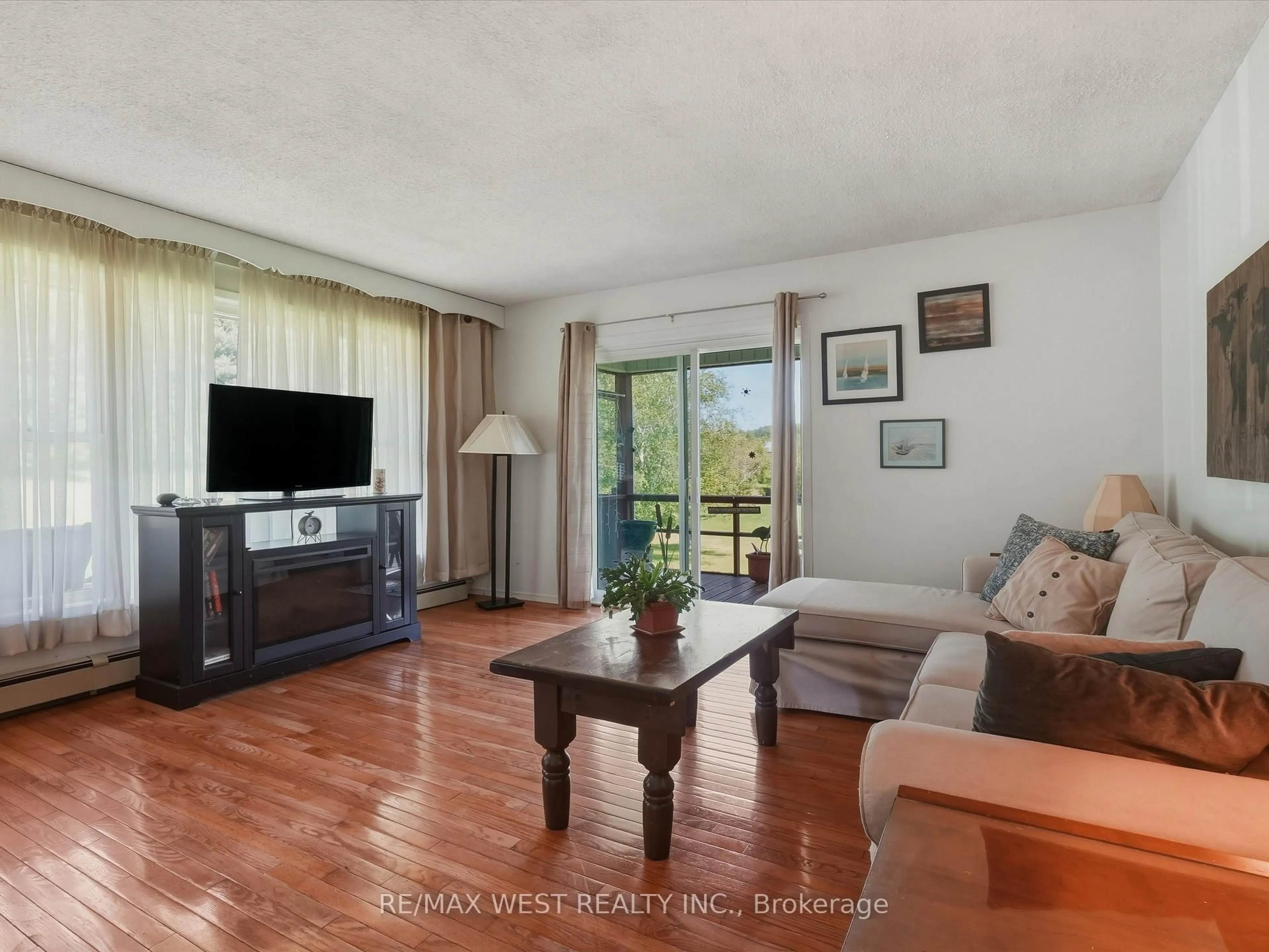 Living room with furniture, wood/laminate floor for 236 Queen St, Burk's Falls Ontario P0A 1C0