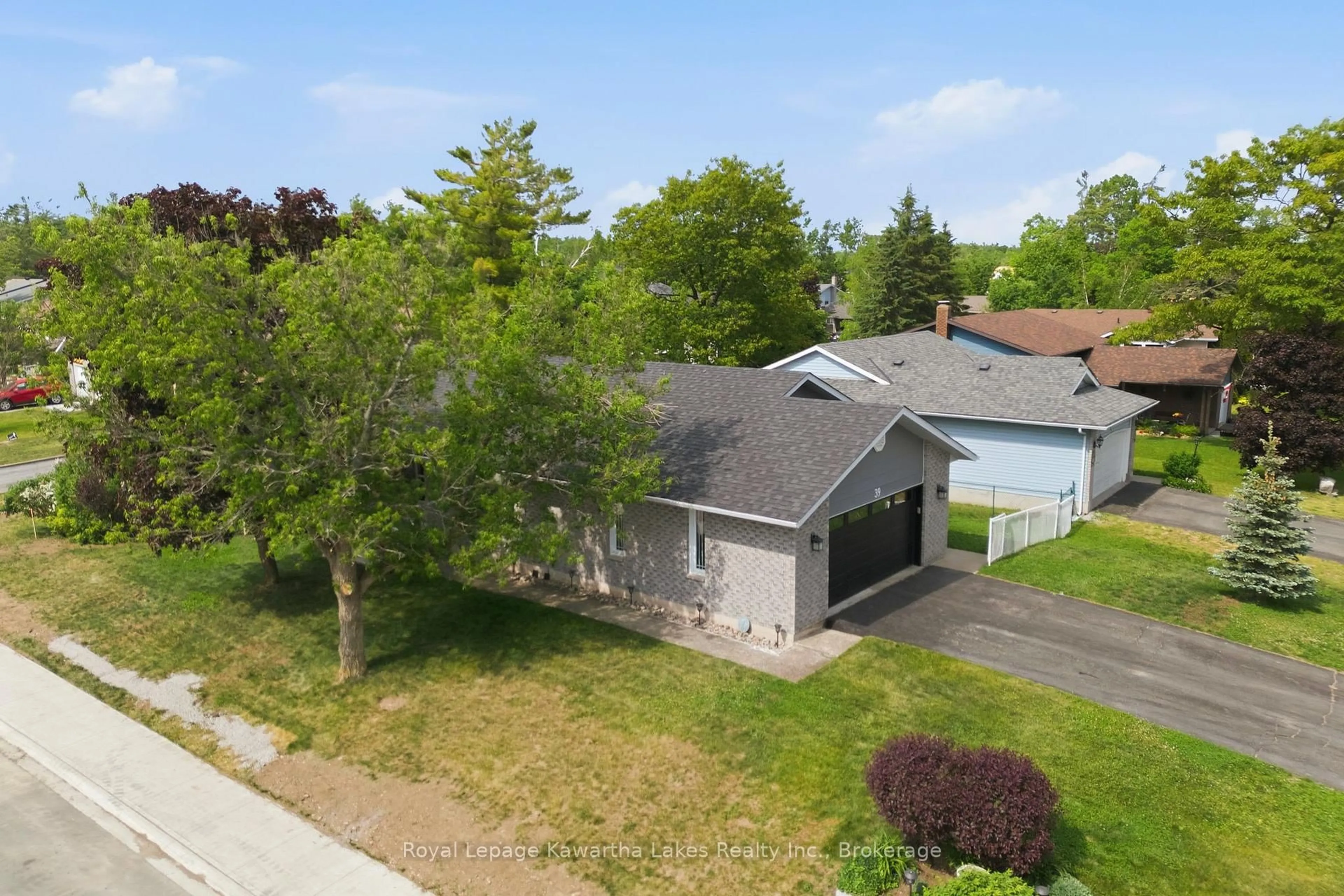 A pic from outside/outdoor area/front of a property/back of a property/a pic from drone, street for 39 Cedartree Lane, Kawartha Lakes Ontario K0M 1A0