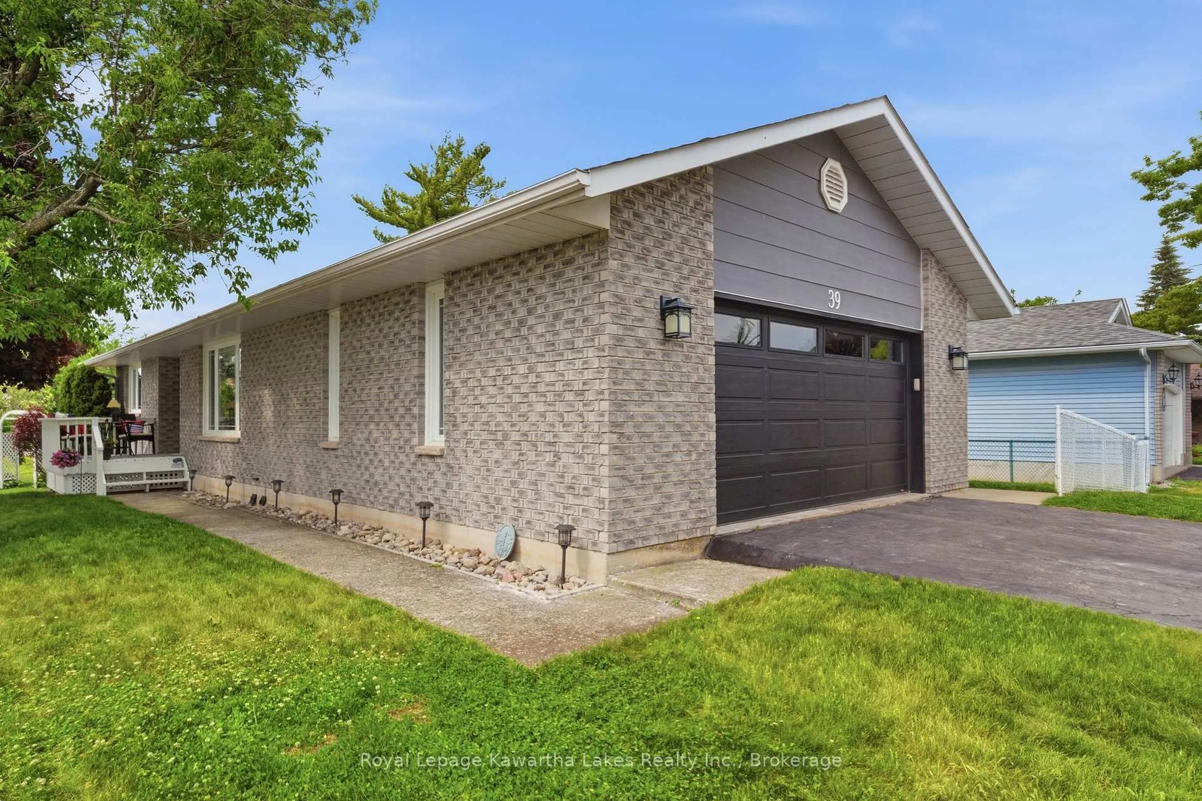 Home with brick exterior material, street for 39 Cedartree Lane, Kawartha Lakes Ontario K0M 1A0