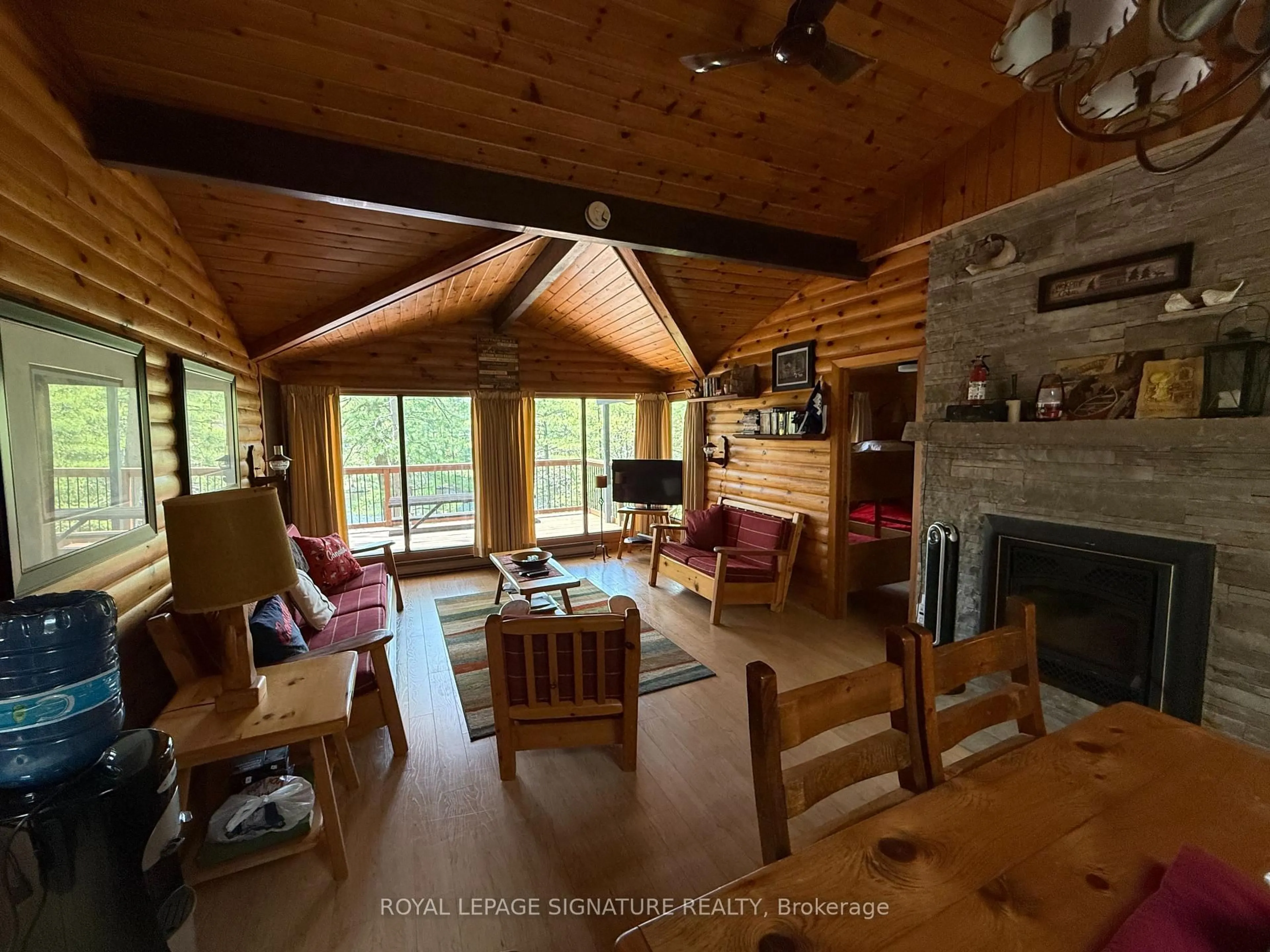Living room with furniture, wood/laminate floor for 1743 North Muldrew Lake Rd, Gravenhurst Ontario P1P 1R2