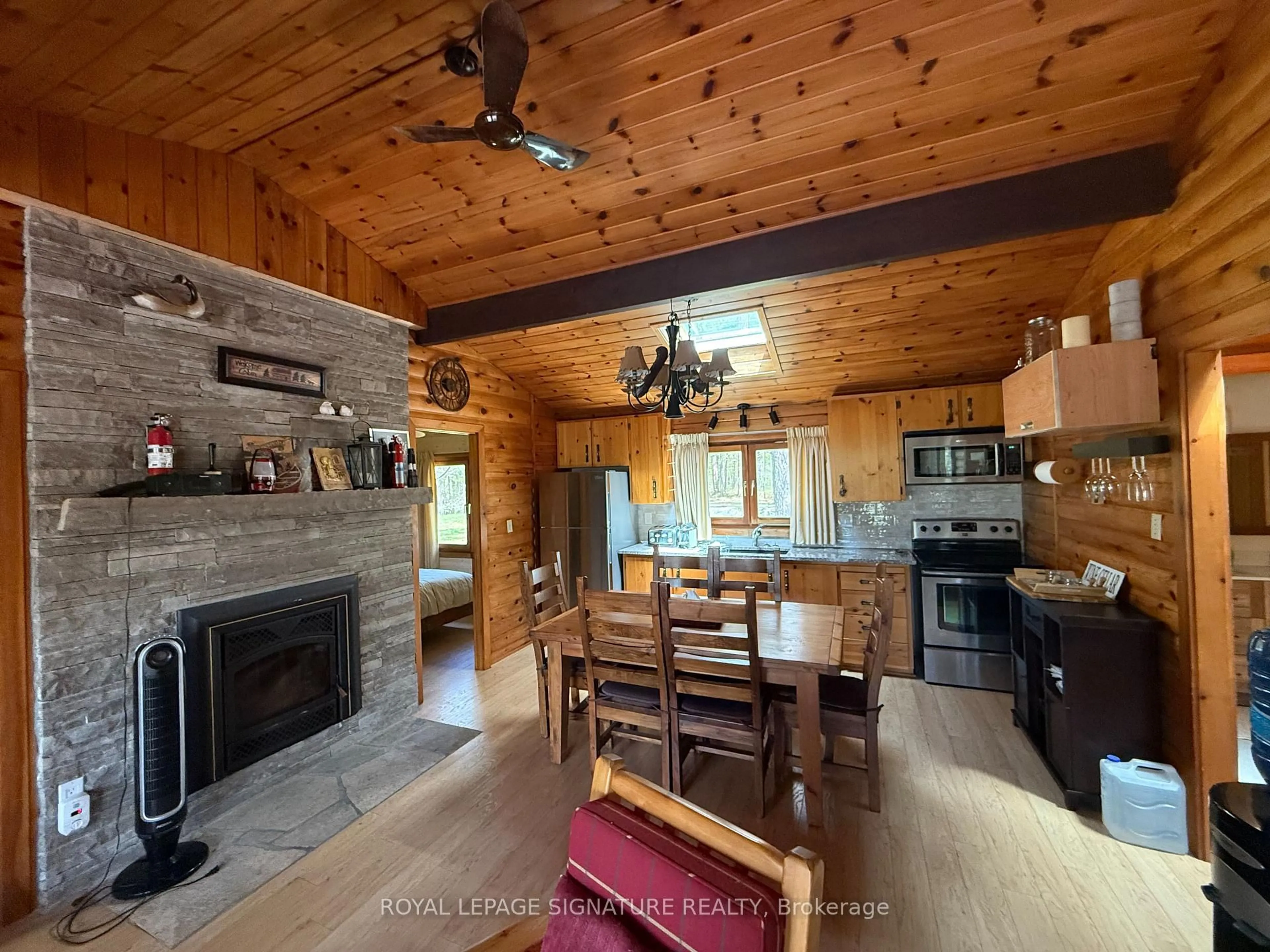 Open concept kitchen, wood/laminate floor for 1743 North Muldrew Lake Rd, Gravenhurst Ontario P1P 1R2