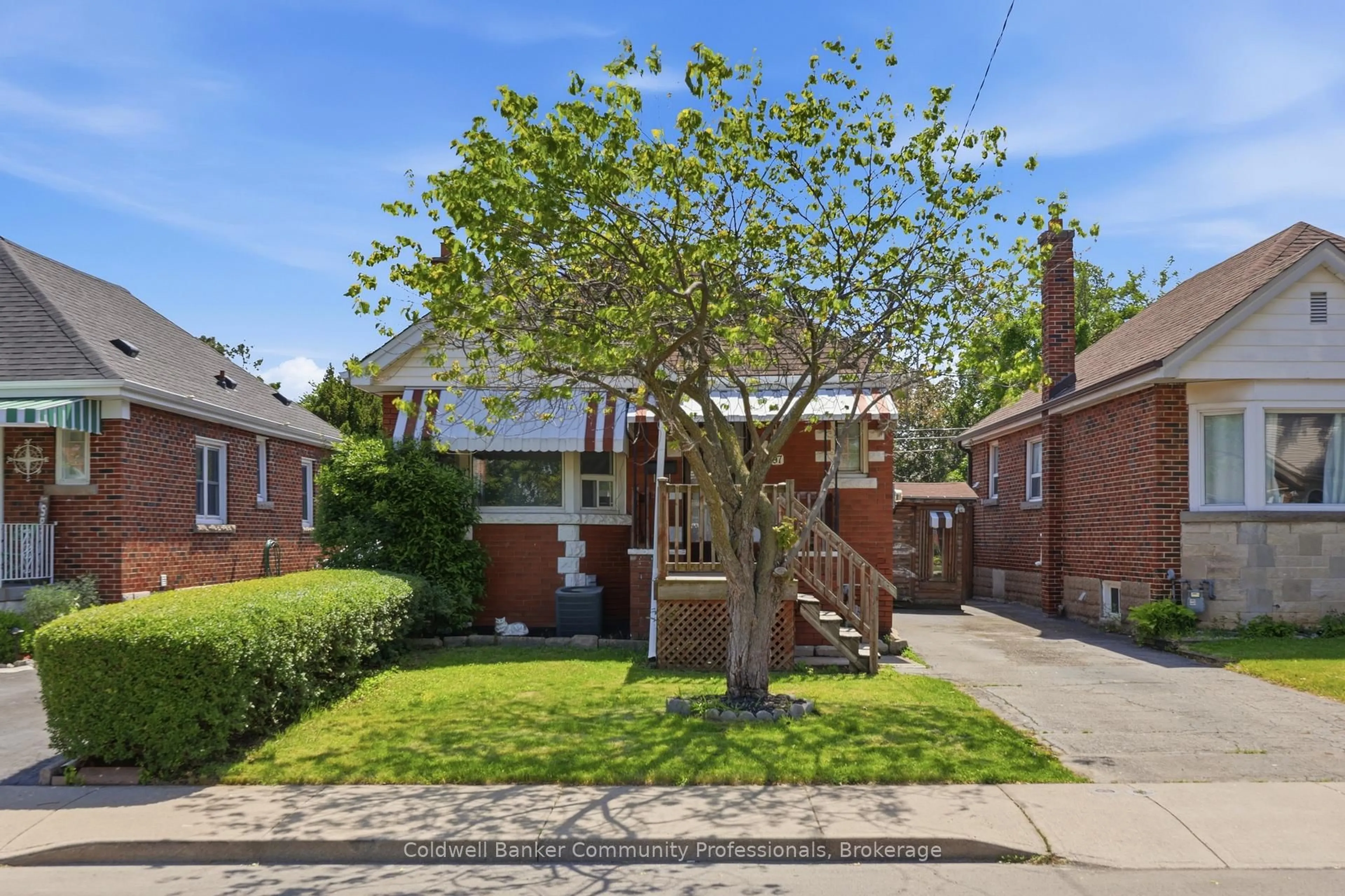 Home with brick exterior material, street for 97 Tragina Ave, Hamilton Ontario L8K 2Z4