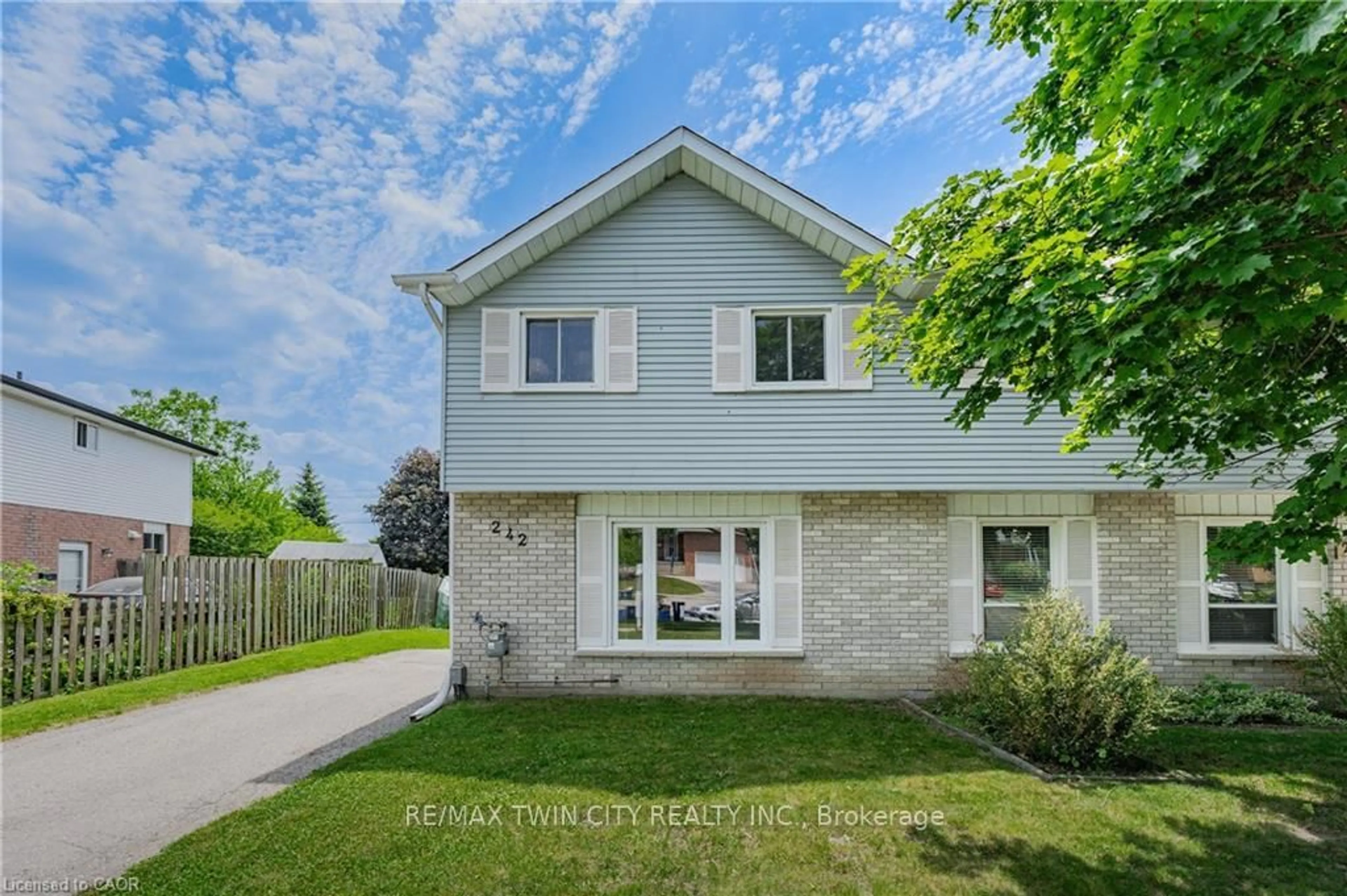 Home with brick exterior material, street for 242 The Country Way, Kitchener Ontario N2E 2P9