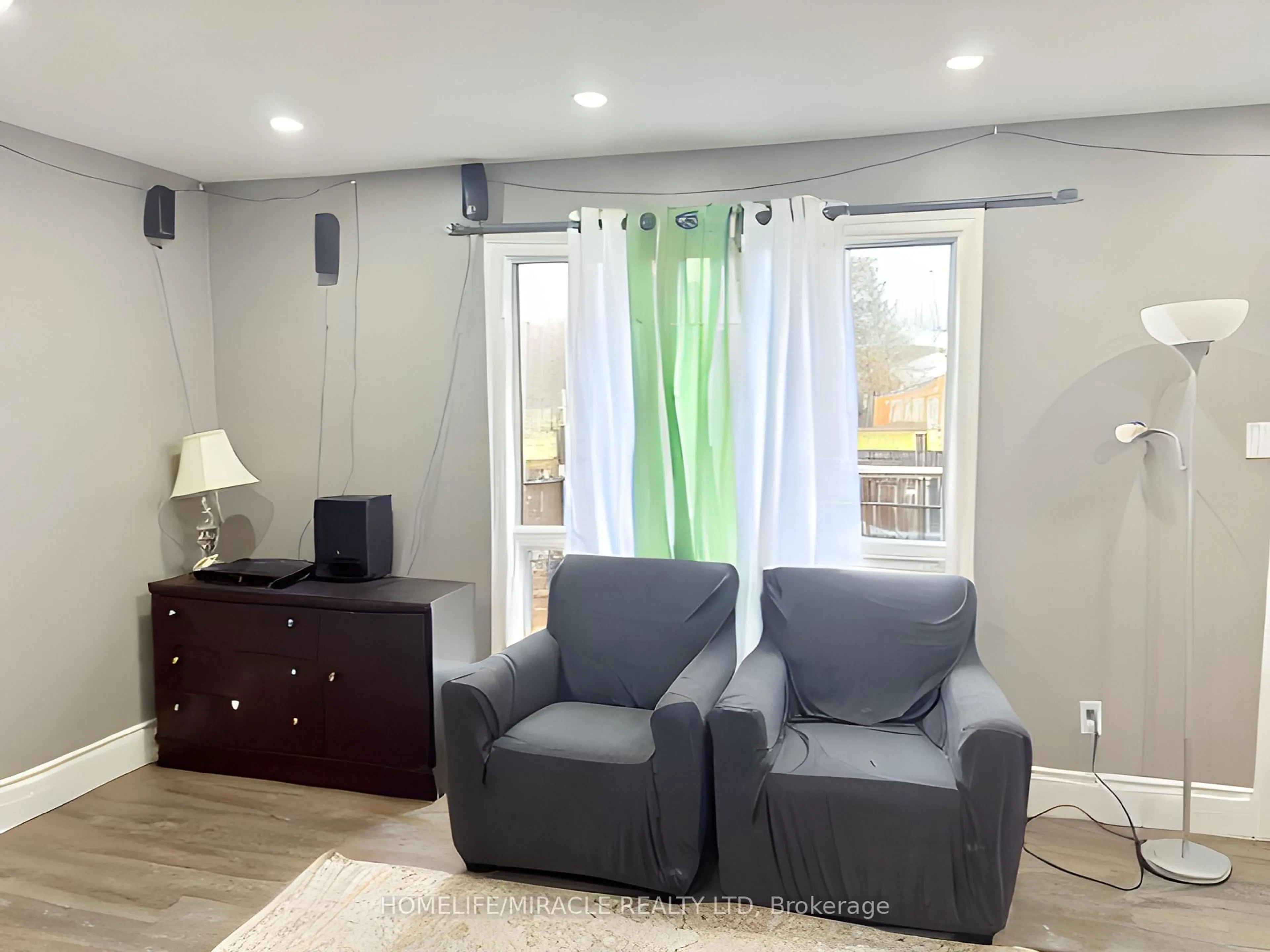 Living room with furniture, wood/laminate floor for 875 Parkinson Rd #22, Woodstock Ontario N4S 8S7