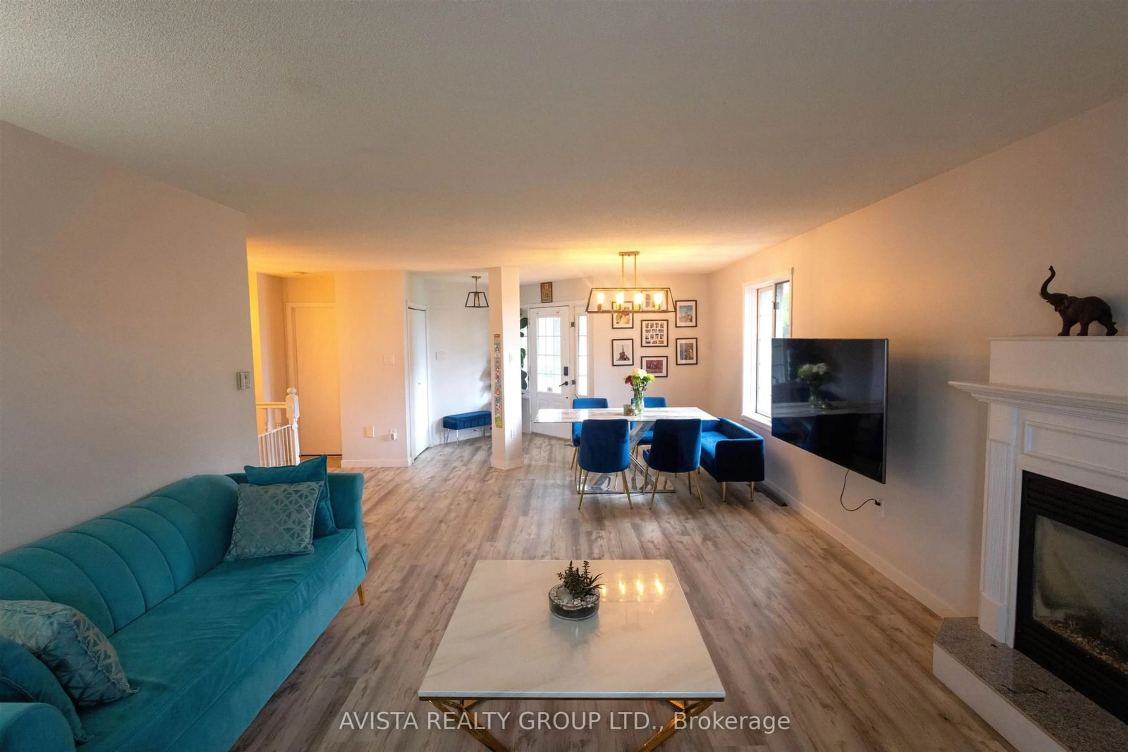 Living room with furniture, wood/laminate floor for 401 Tuscany Dr, Thunder Bay Ontario P7G 1B7