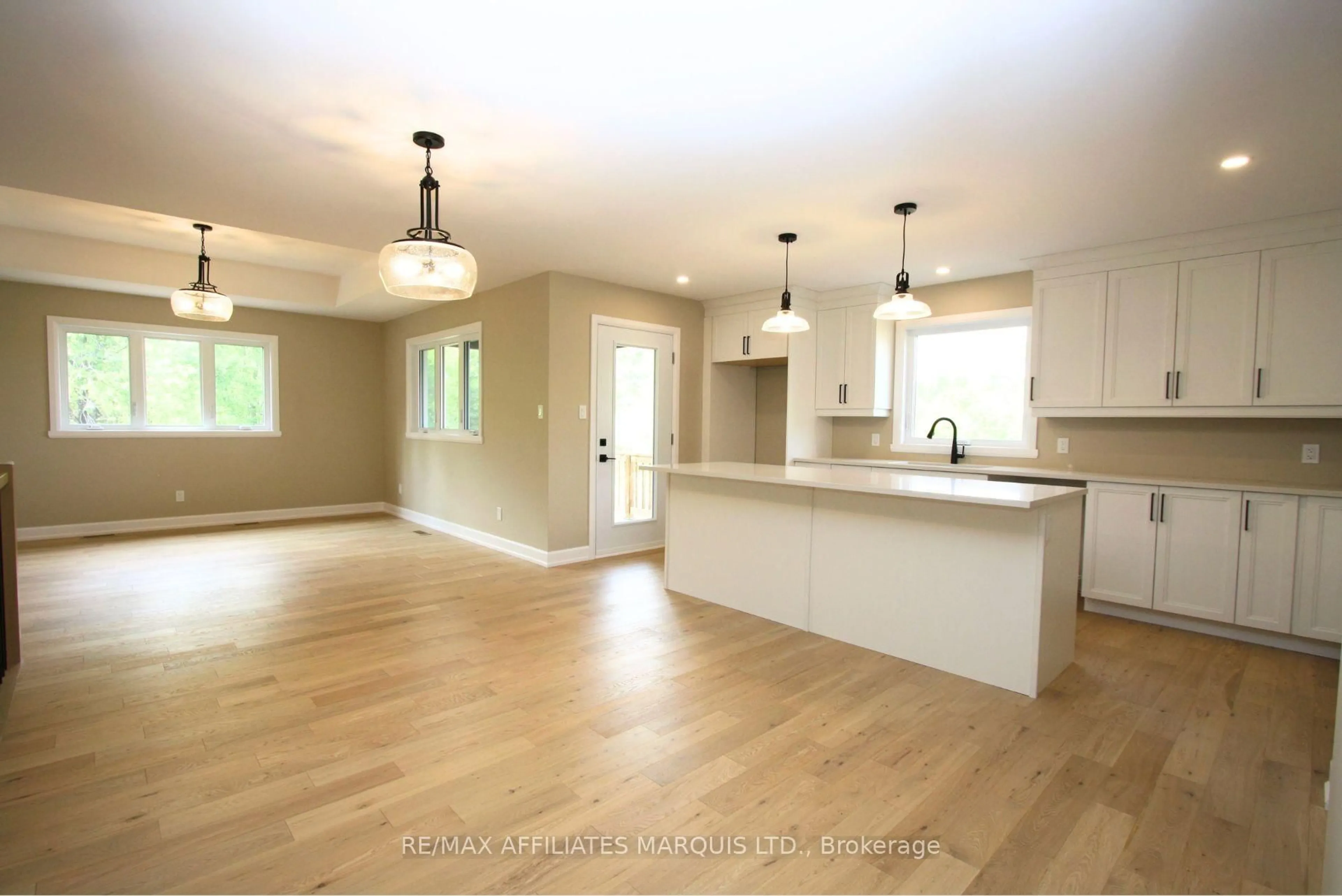 Open concept kitchen, wood/laminate floor for 2542 Macgregor Dr, South Glengarry Ontario K0C 1E0