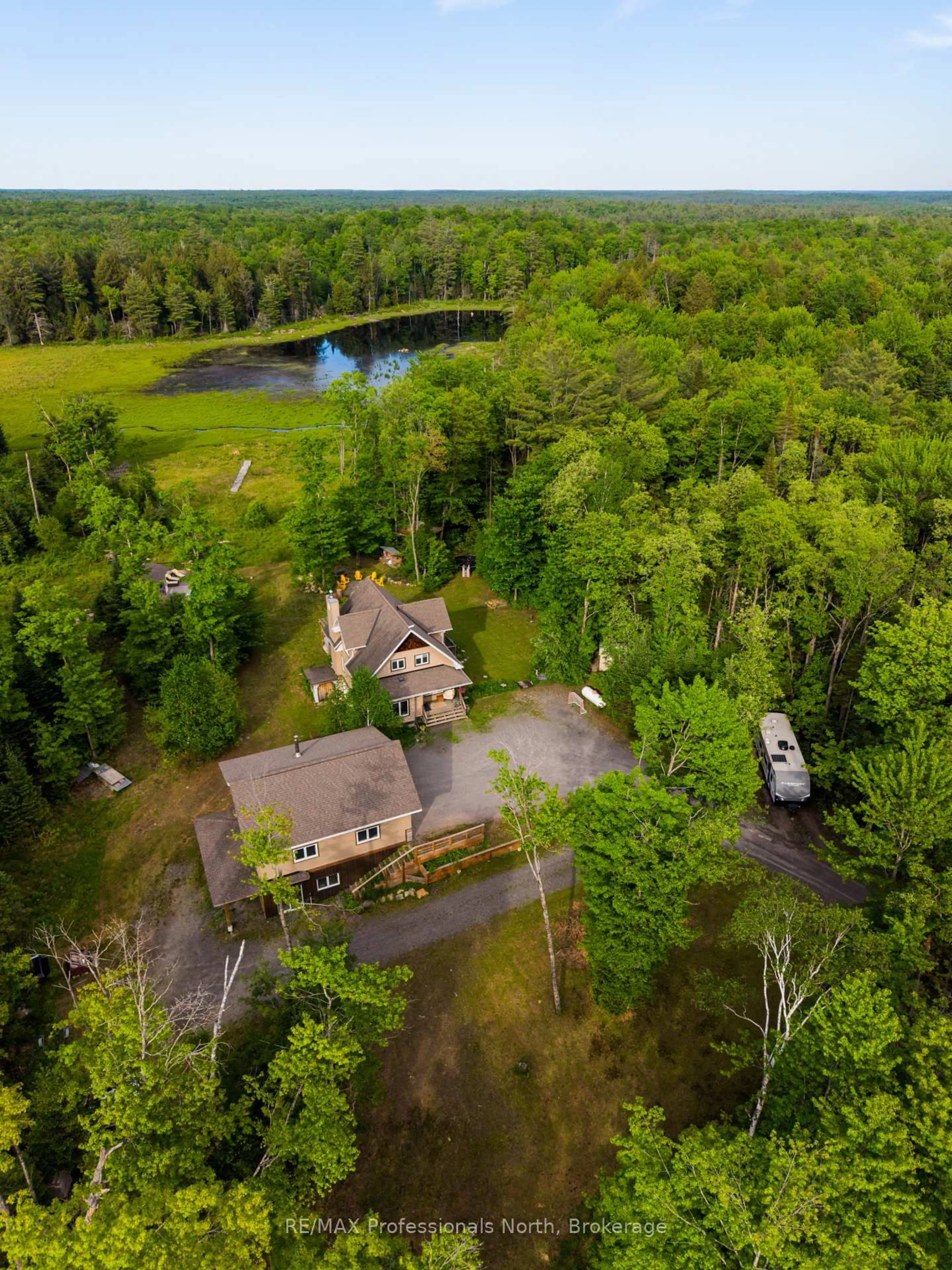 A pic from outside/outdoor area/front of a property/back of a property/a pic from drone, water/lake/river/ocean view for 1289 Purbrook Rd, Bracebridge Ontario P1L 1X3