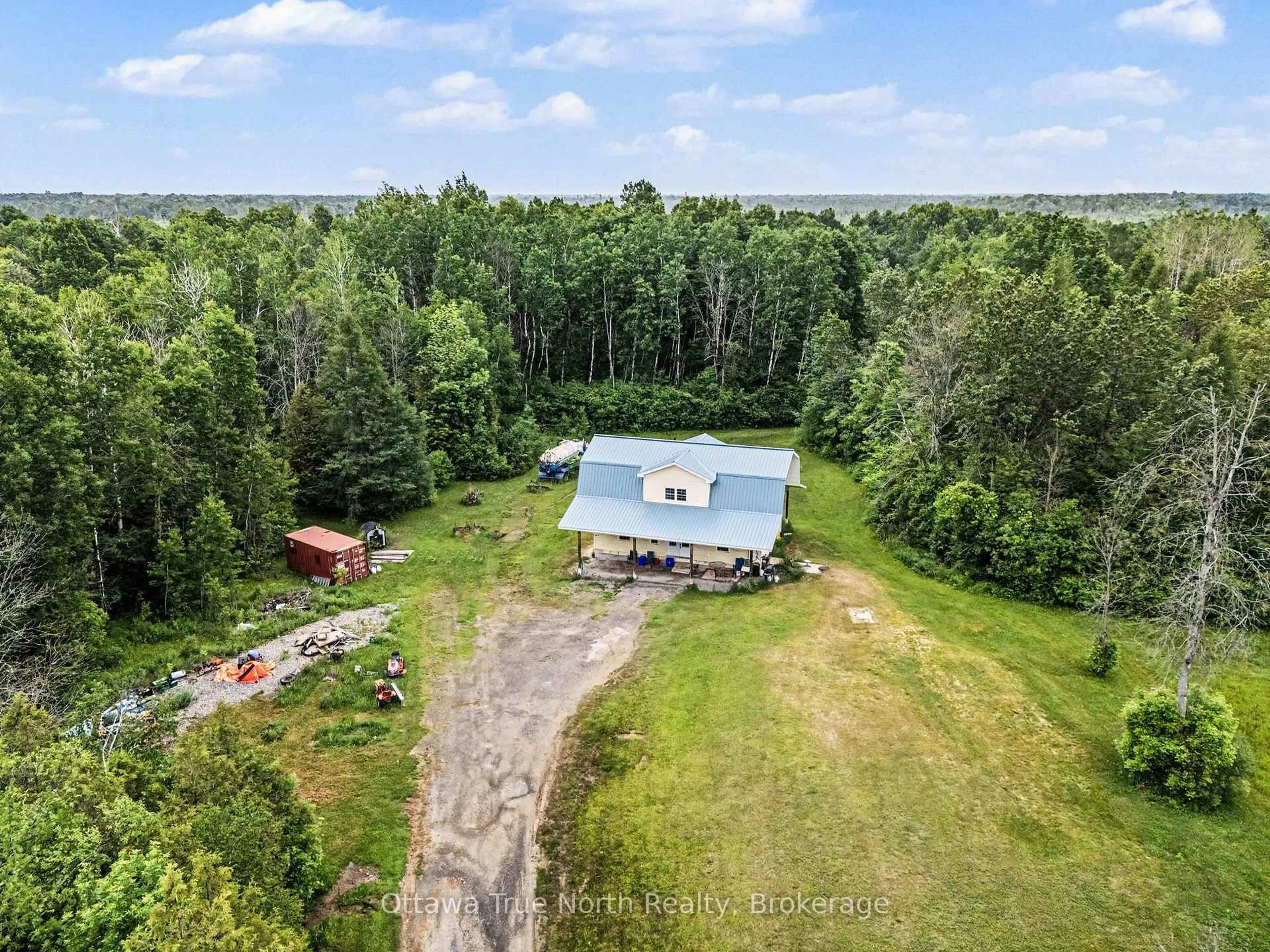 A pic from outside/outdoor area/front of a property/back of a property/a pic from drone, forest/trees view for 401 Kerford Rd, Merrickville-Wolford Ontario K0G 1N0