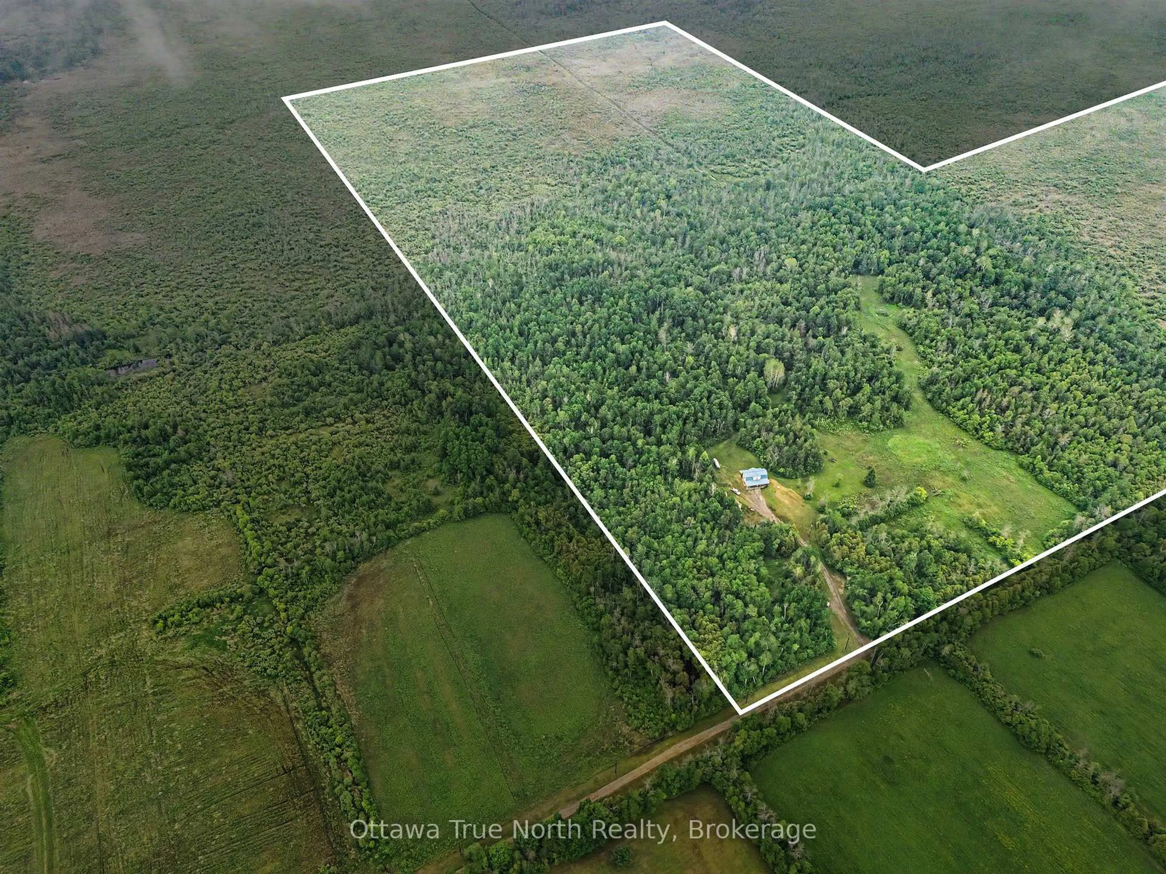 A pic from outside/outdoor area/front of a property/back of a property/a pic from drone, forest/trees view for 401 Kerford Rd, Merrickville-Wolford Ontario K0G 1N0