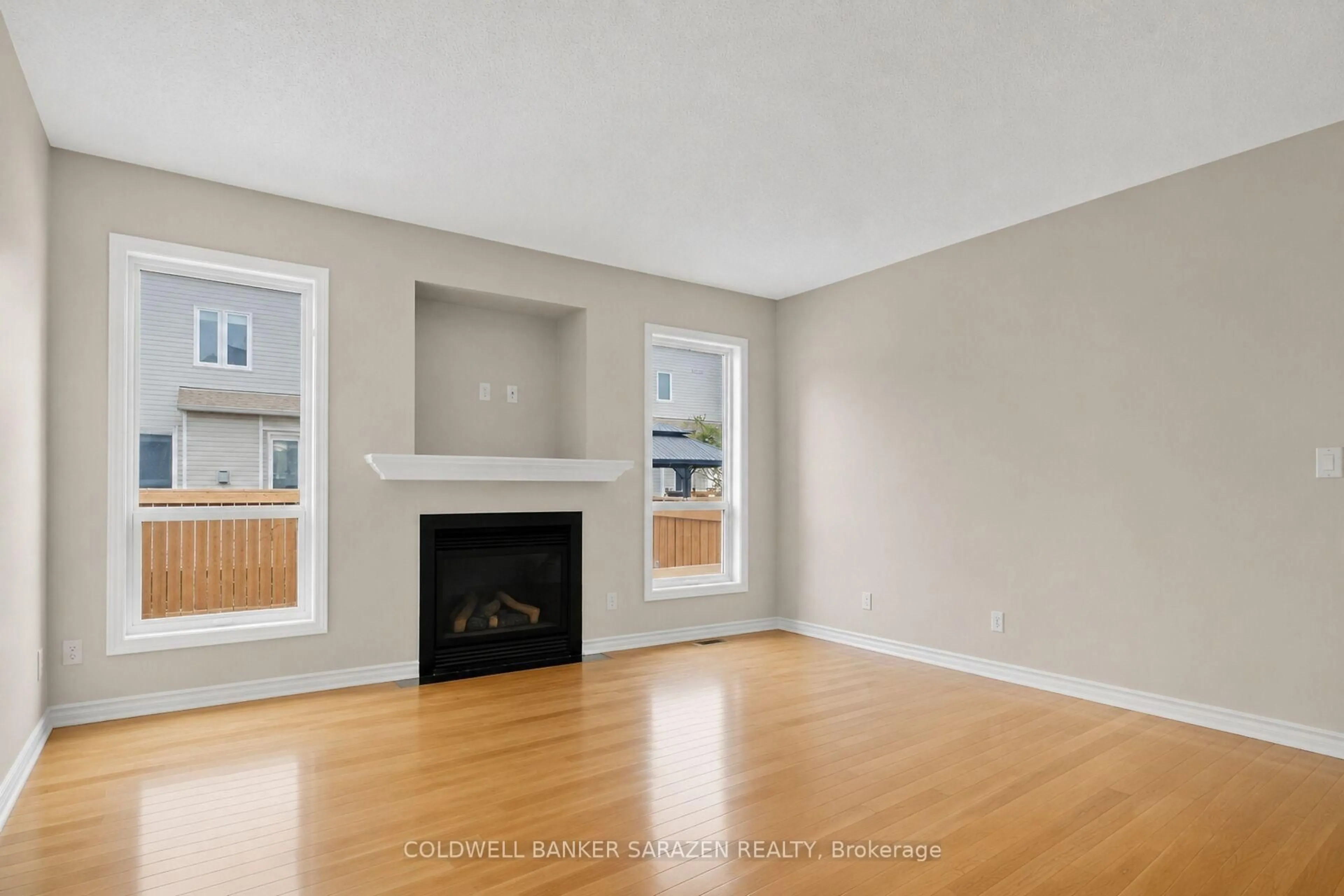 Living room with furniture, wood/laminate floor for 7 Barnstone Dr, Ottawa Ontario K2G 6X2