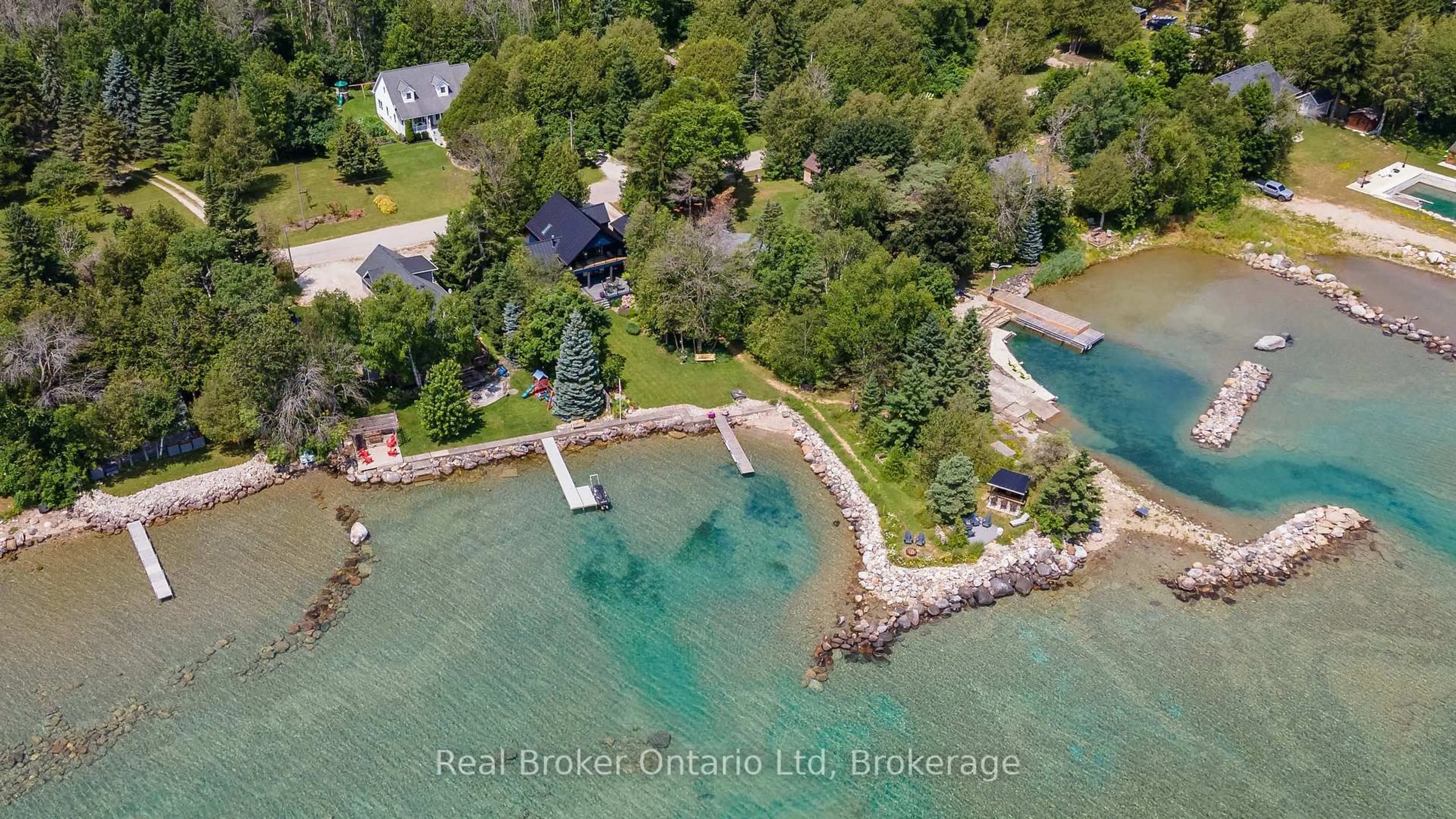 A pic from outside/outdoor area/front of a property/back of a property/a pic from drone, water/lake/river/ocean view for 339595 Presqu'ile Rd, Georgian Bluffs Ontario N0H 1S0