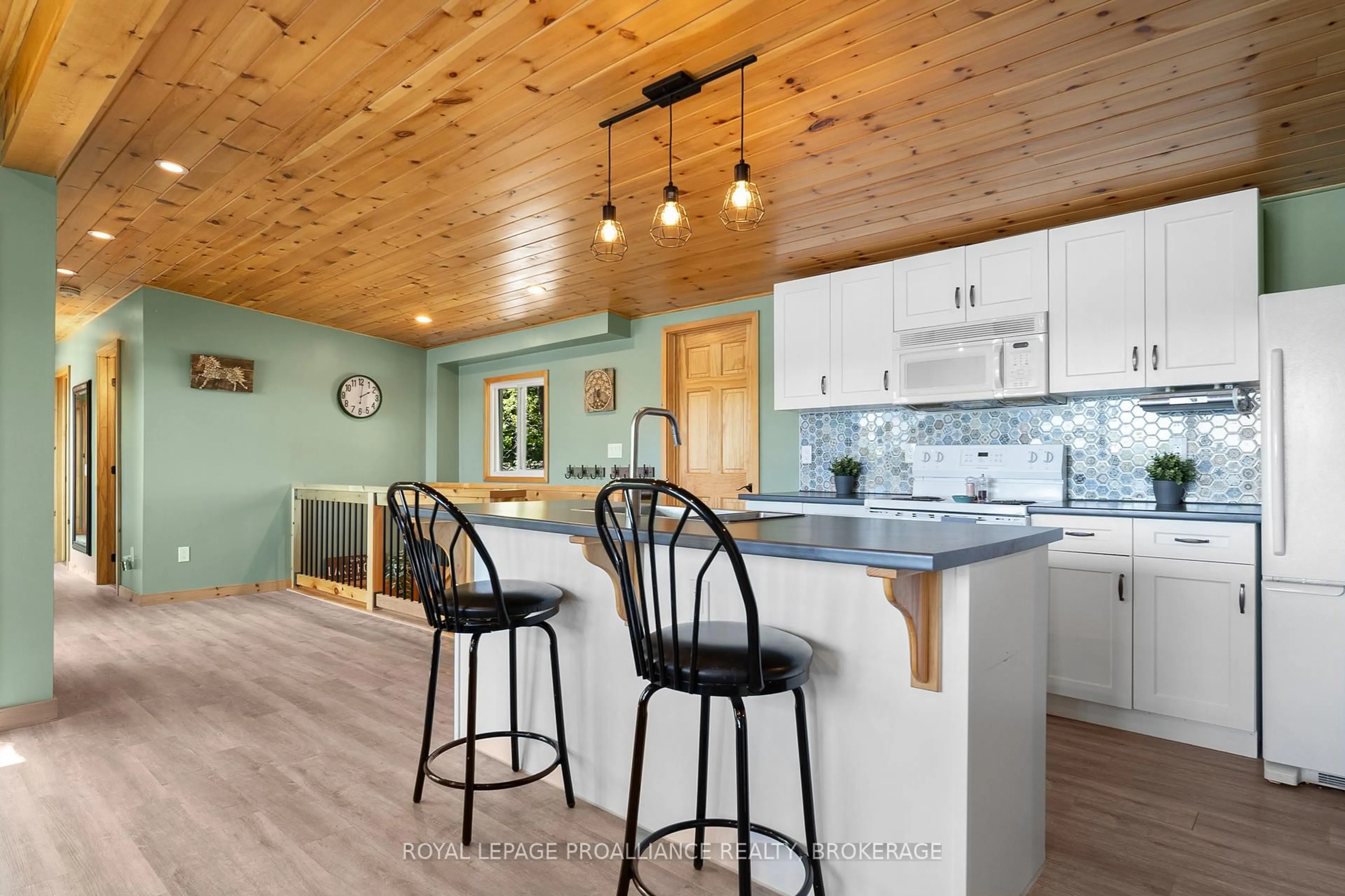 Open concept kitchen, wood/laminate floor for 402 Troy Lake Rd, Rideau Lakes Ontario K0G 1E0