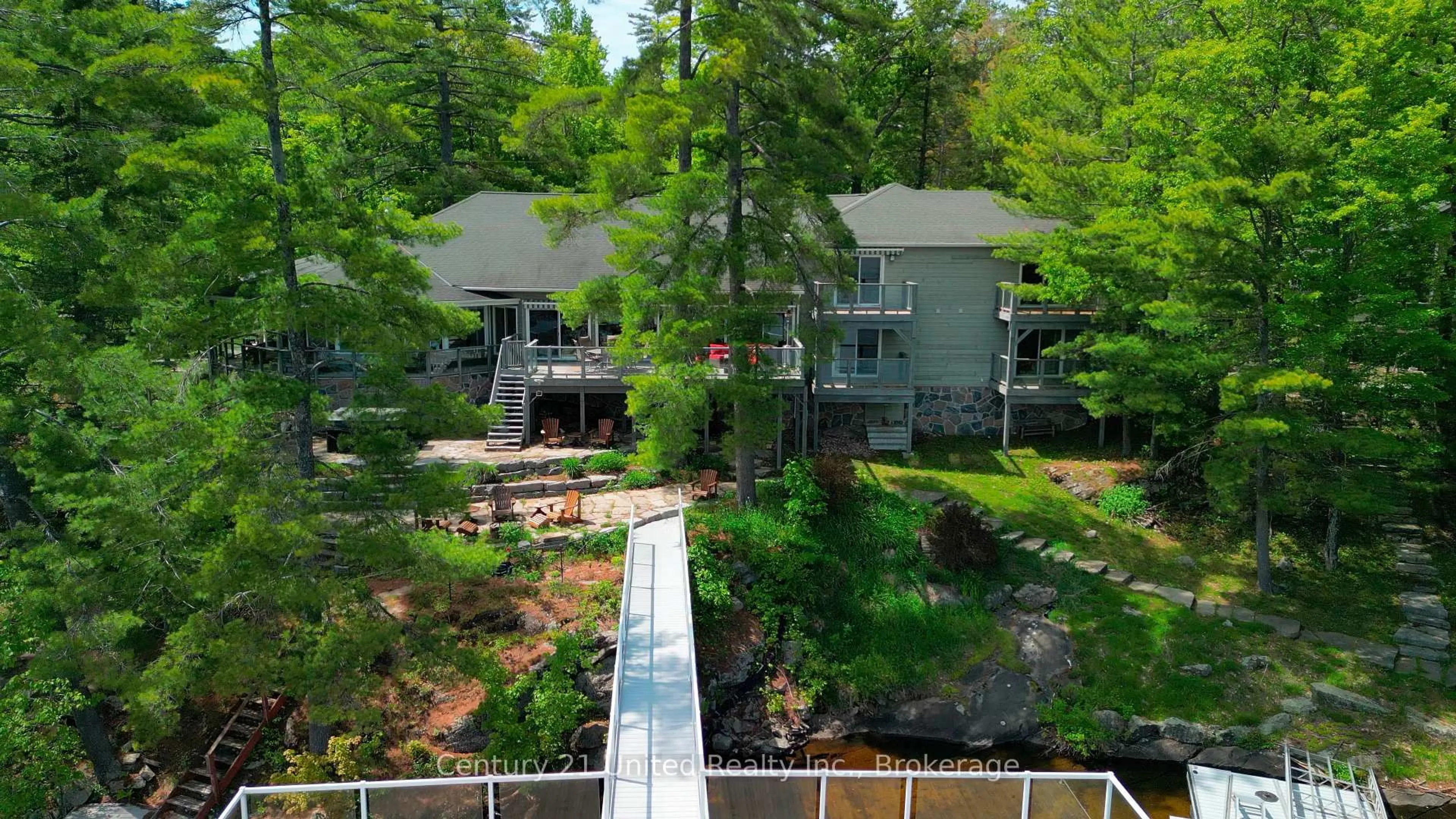 A pic from outside/outdoor area/front of a property/back of a property/a pic from drone, water/lake/river/ocean view for 32 Fire Route 172, Trent Lakes Ontario K0L 1J0