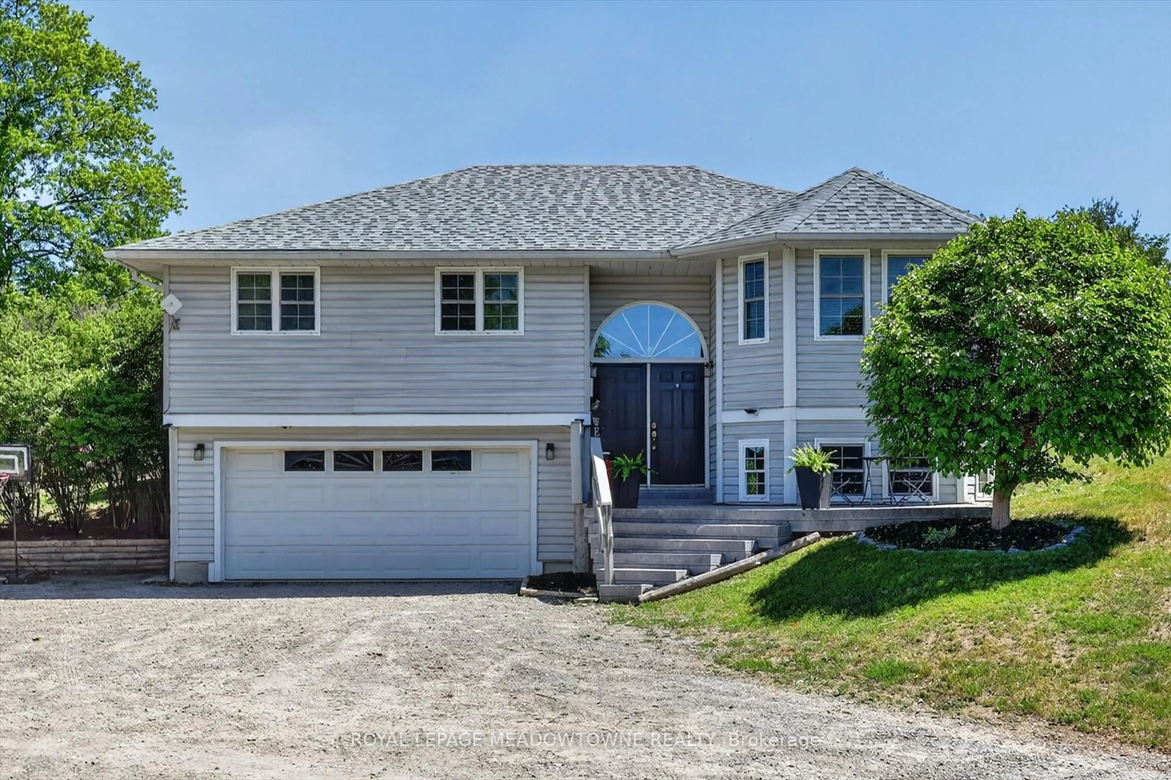 Home with vinyl exterior material, street for 1073 Serpent Mounds Rd, Otonabee-South Monaghan Ontario K0L 2G0