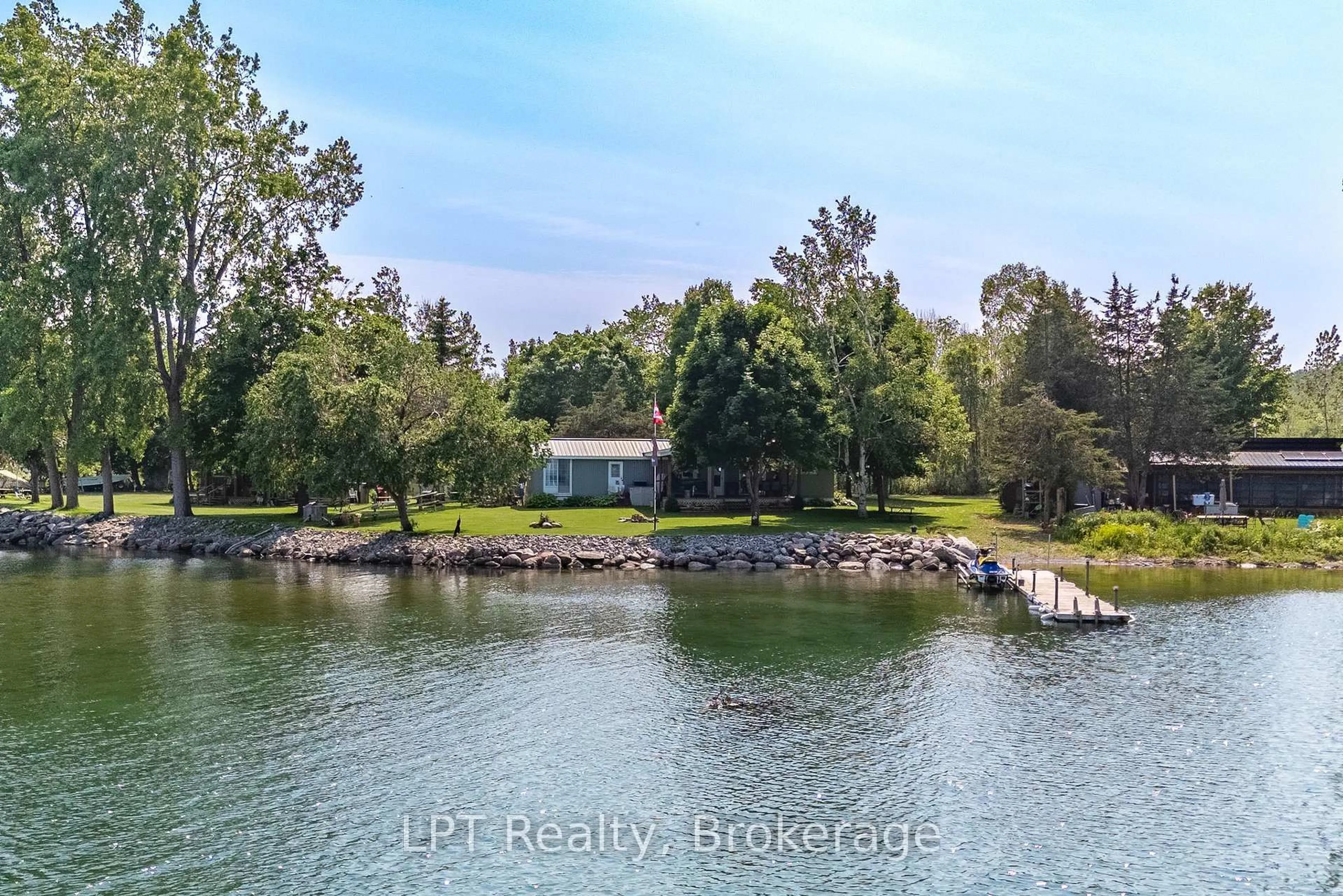 A pic from outside/outdoor area/front of a property/back of a property/a pic from drone, water/lake/river/ocean view for 85 Pirates Cove Lane, Prince Edward County Ontario K0K 2P0