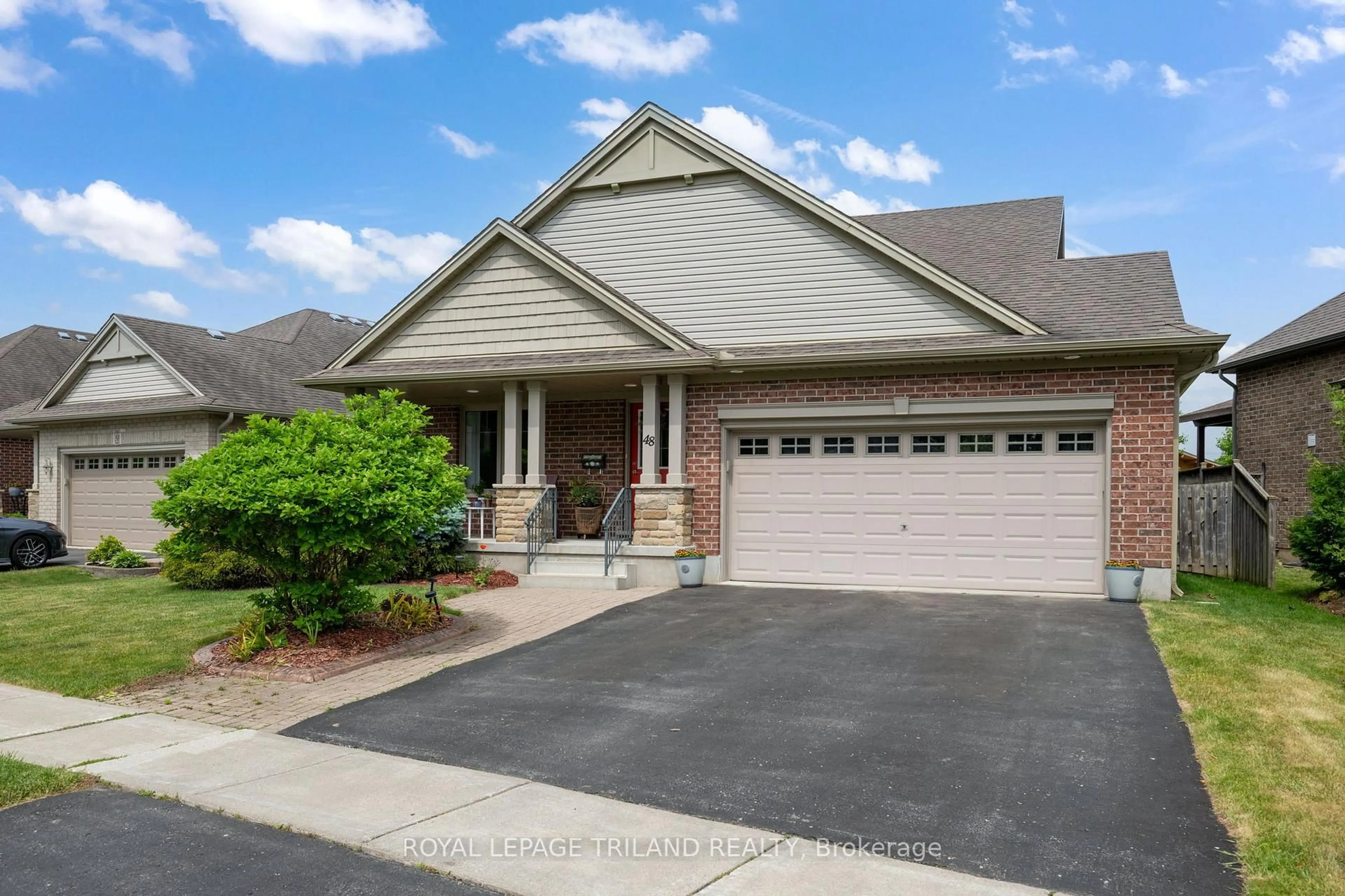 Home with vinyl exterior material, street for 48 Circlewood Dr, St. Thomas Ontario N5P 4P3