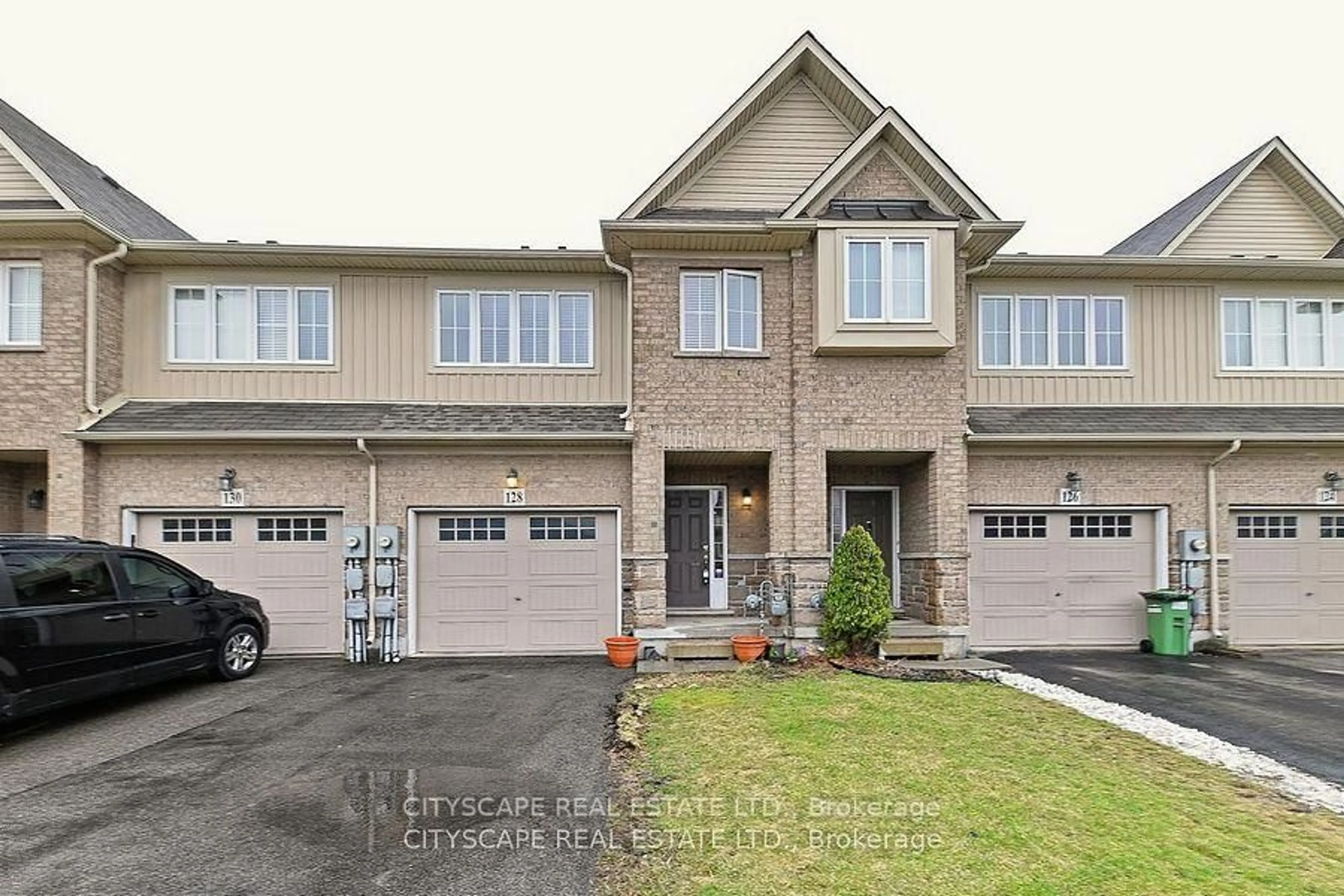 Home with brick exterior material, street for 128 Palacebeach Tr, Hamilton Ontario L8E 0C3