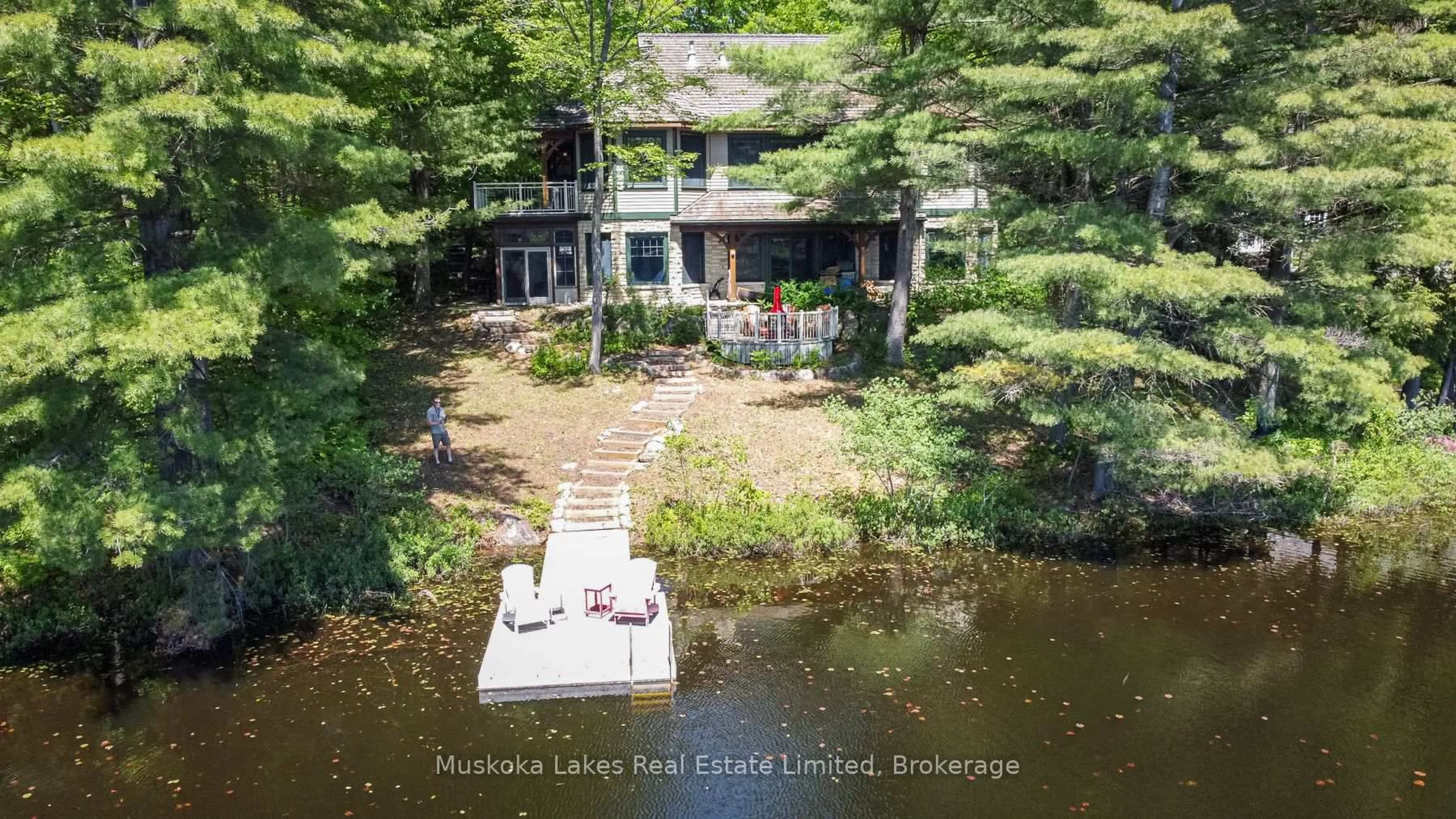 A pic from outside/outdoor area/front of a property/back of a property/a pic from drone, water/lake/river/ocean view for 45 Estate Dr, Muskoka Lakes Ontario P0B 1J0