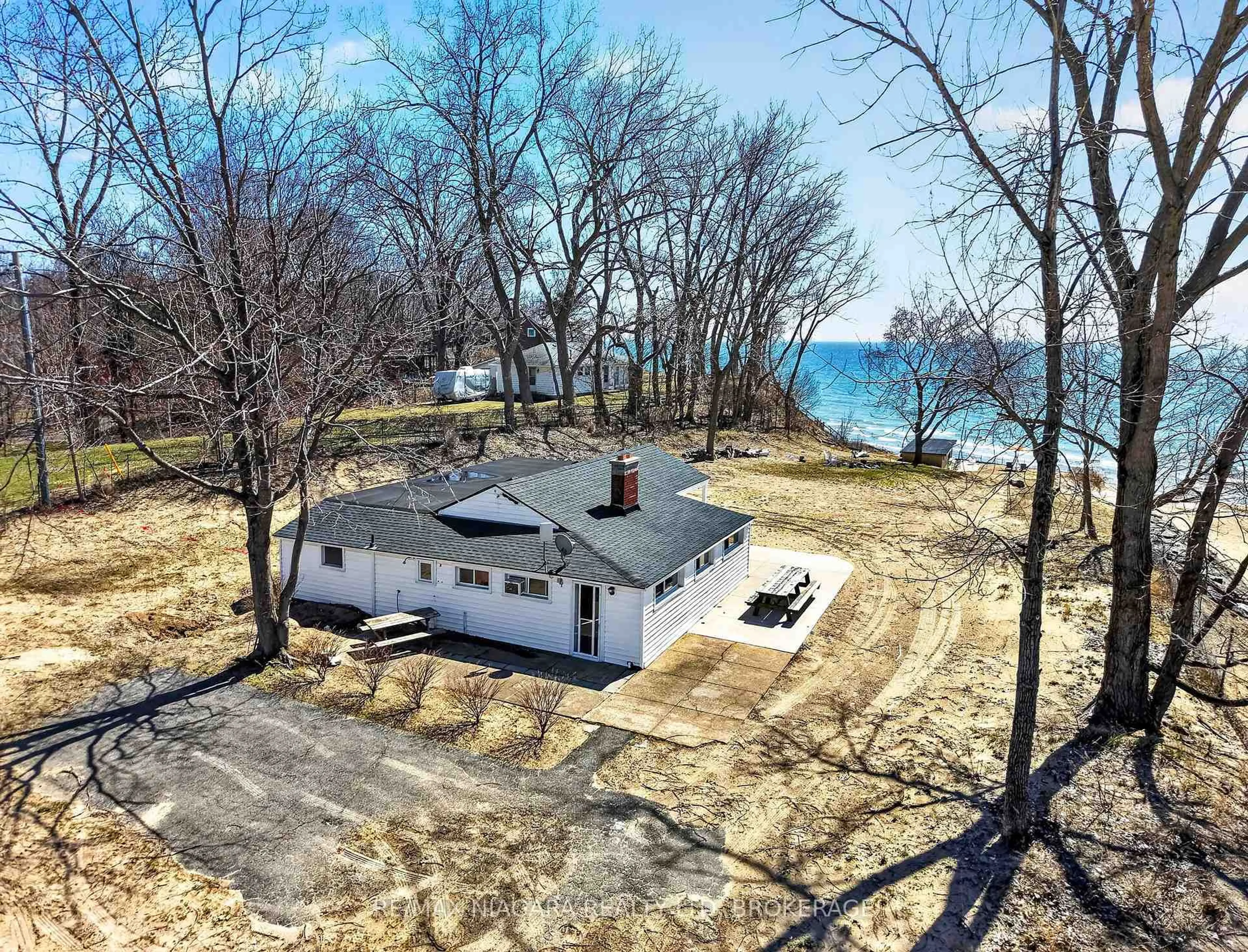 A pic from outside/outdoor area/front of a property/back of a property/a pic from drone, water/lake/river/ocean view for 239 Pleasant Beach Rd, Port Colborne Ontario L0S 1R0