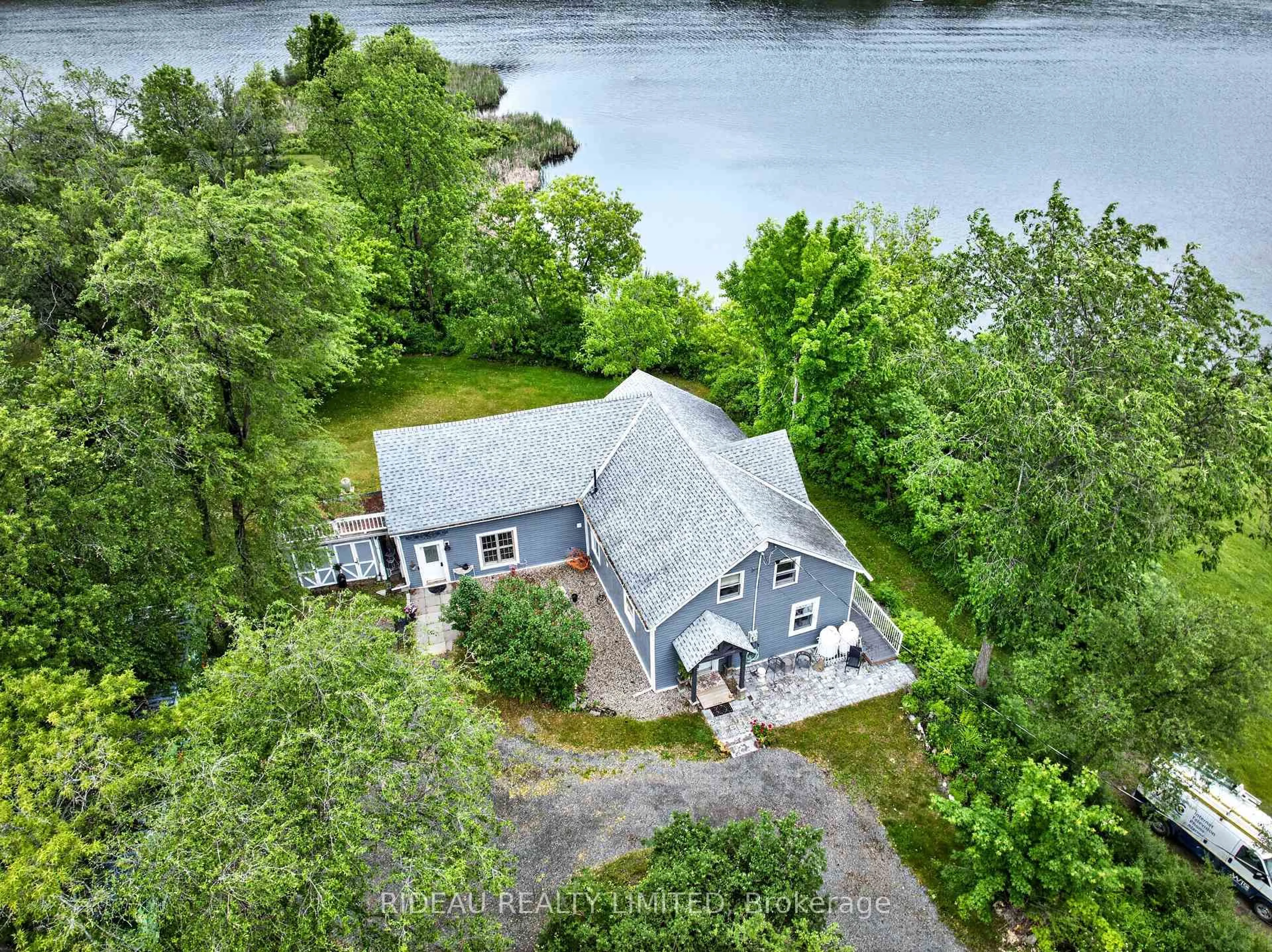 A pic from outside/outdoor area/front of a property/back of a property/a pic from drone, water/lake/river/ocean view for 18 Bedford St, Westport Ontario K0G 1X0