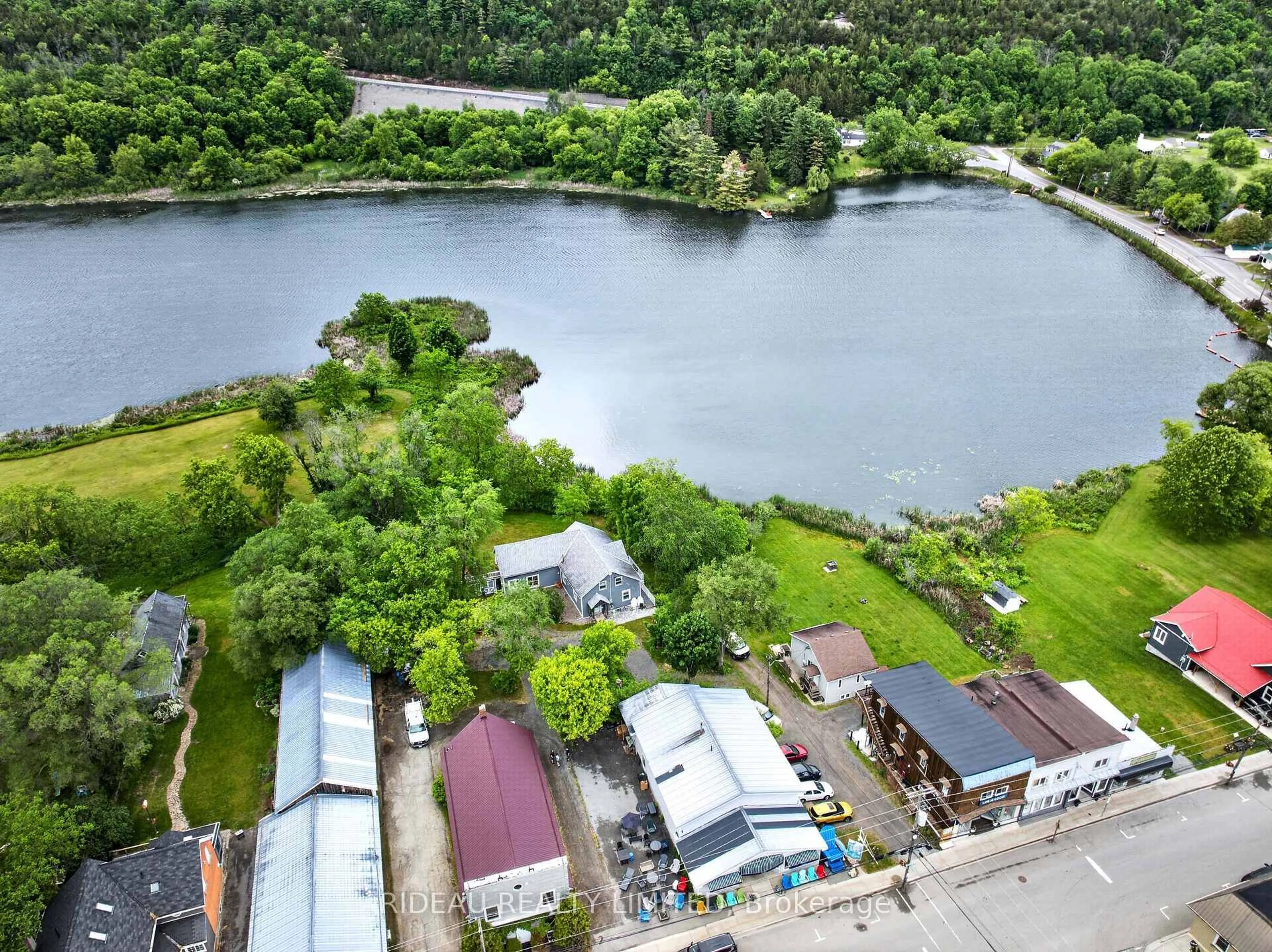 A pic from outside/outdoor area/front of a property/back of a property/a pic from drone, water/lake/river/ocean view for 18 Bedford St, Westport Ontario K0G 1X0