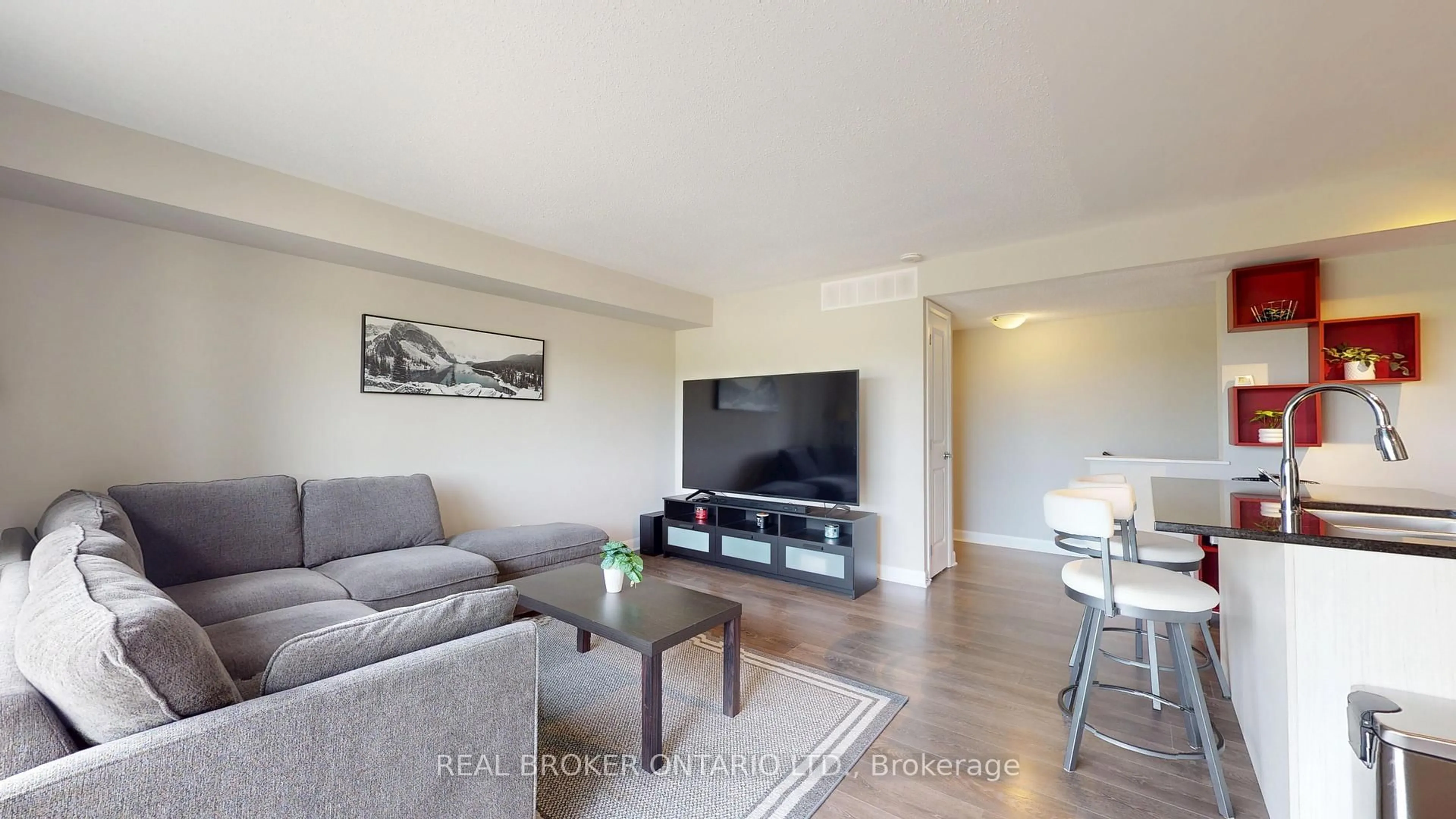 Living room with furniture, wood/laminate floor for 1213 Chapman Mills Dr #2, Ottawa Ontario K2J 6R5