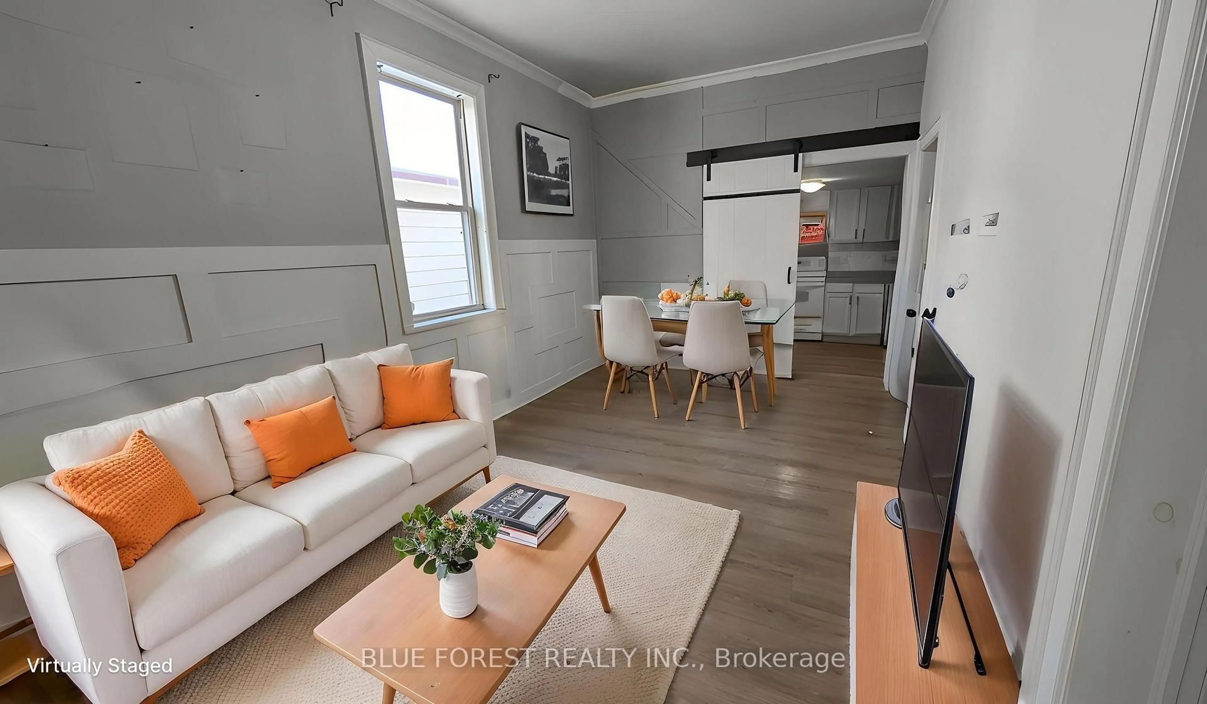 Living room with furniture, wood/laminate floor for 190 Clarence St, London East Ontario N6B 2J7