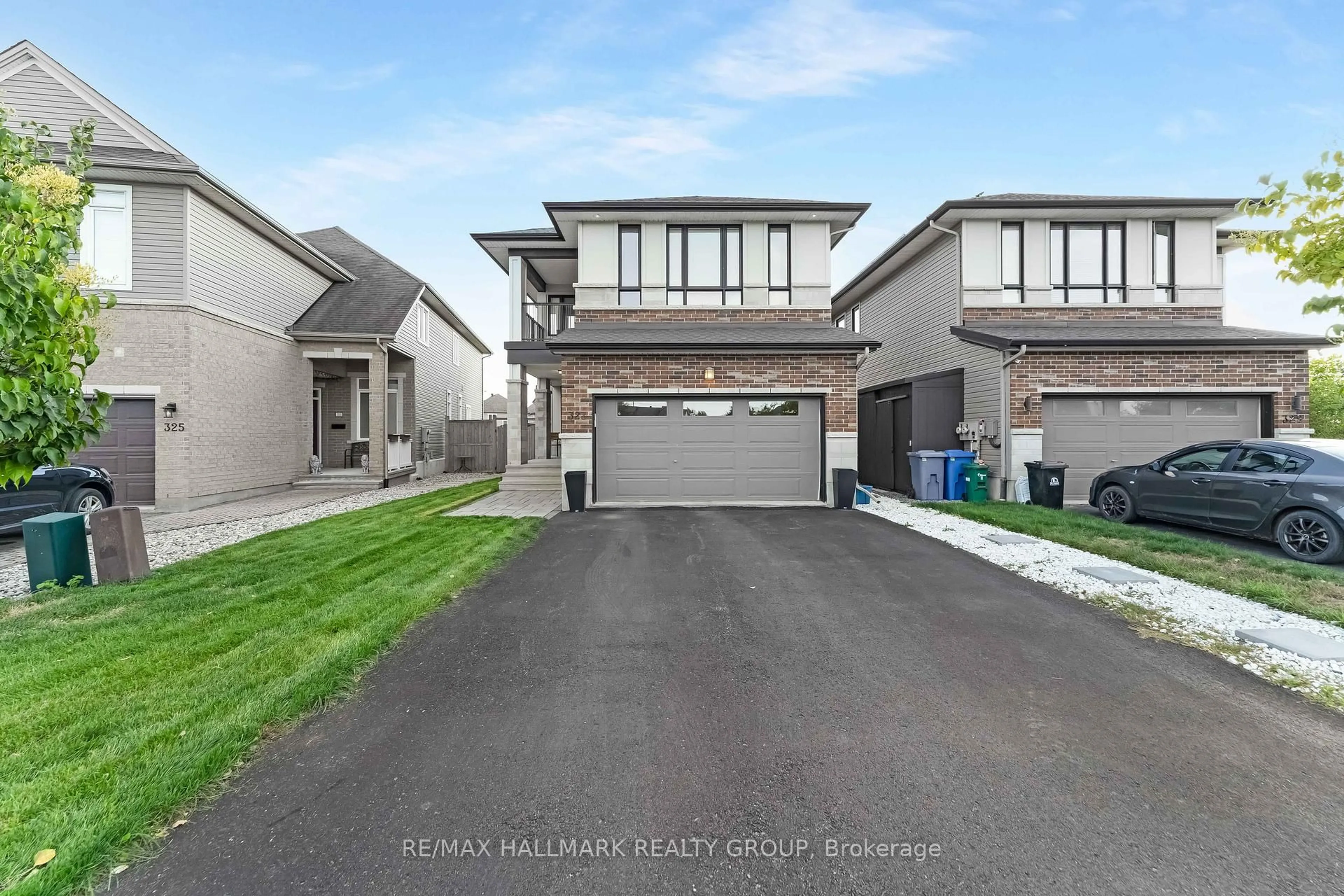 A pic from outside/outdoor area/front of a property/back of a property/a pic from drone, street for 327 BALLINVILLE Circ, Ottawa Ontario K4M 0C4