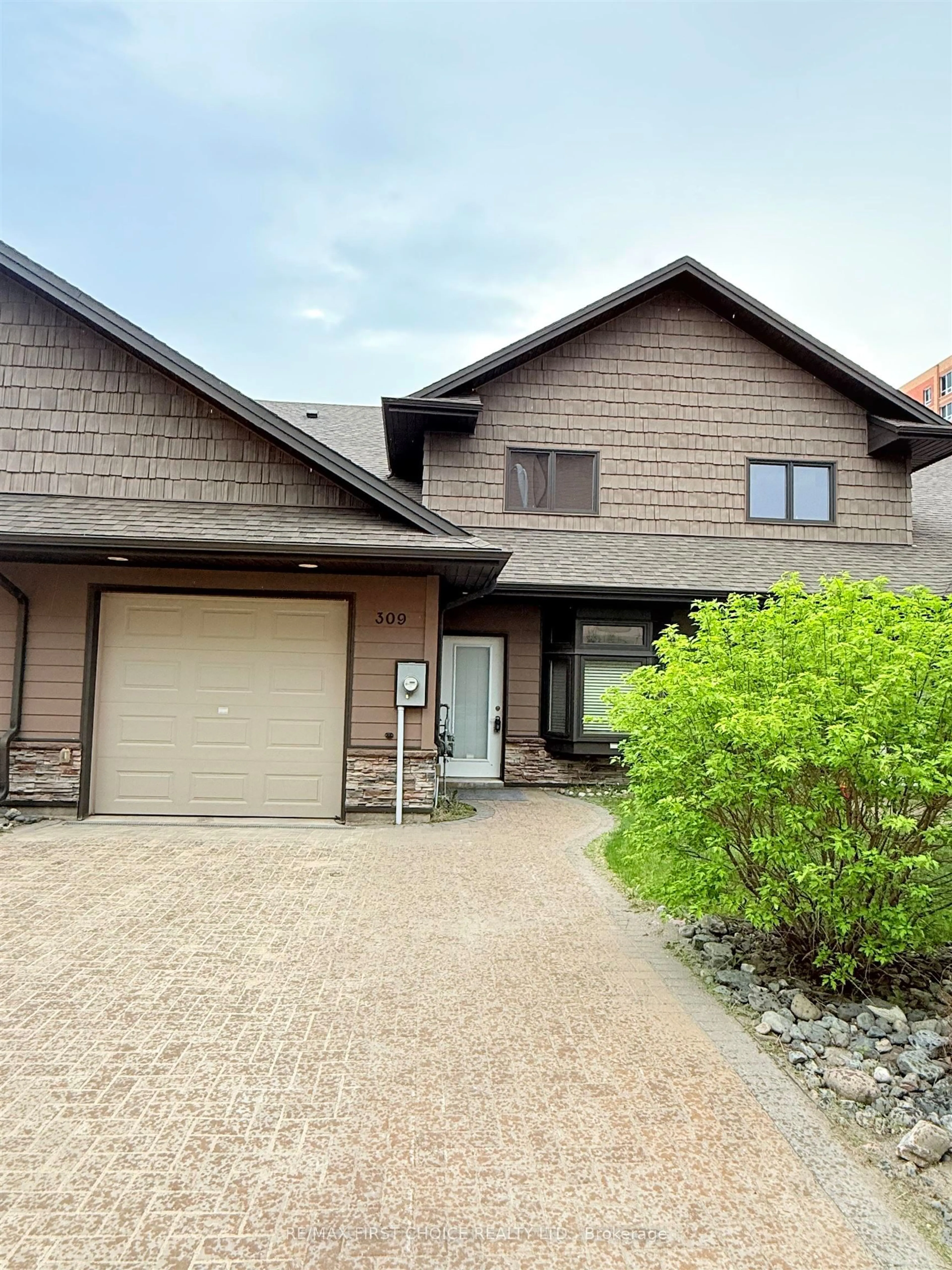 Home with brick exterior material, street for 309 Oasis Lane, Thunder Bay Ontario P7B 0C1