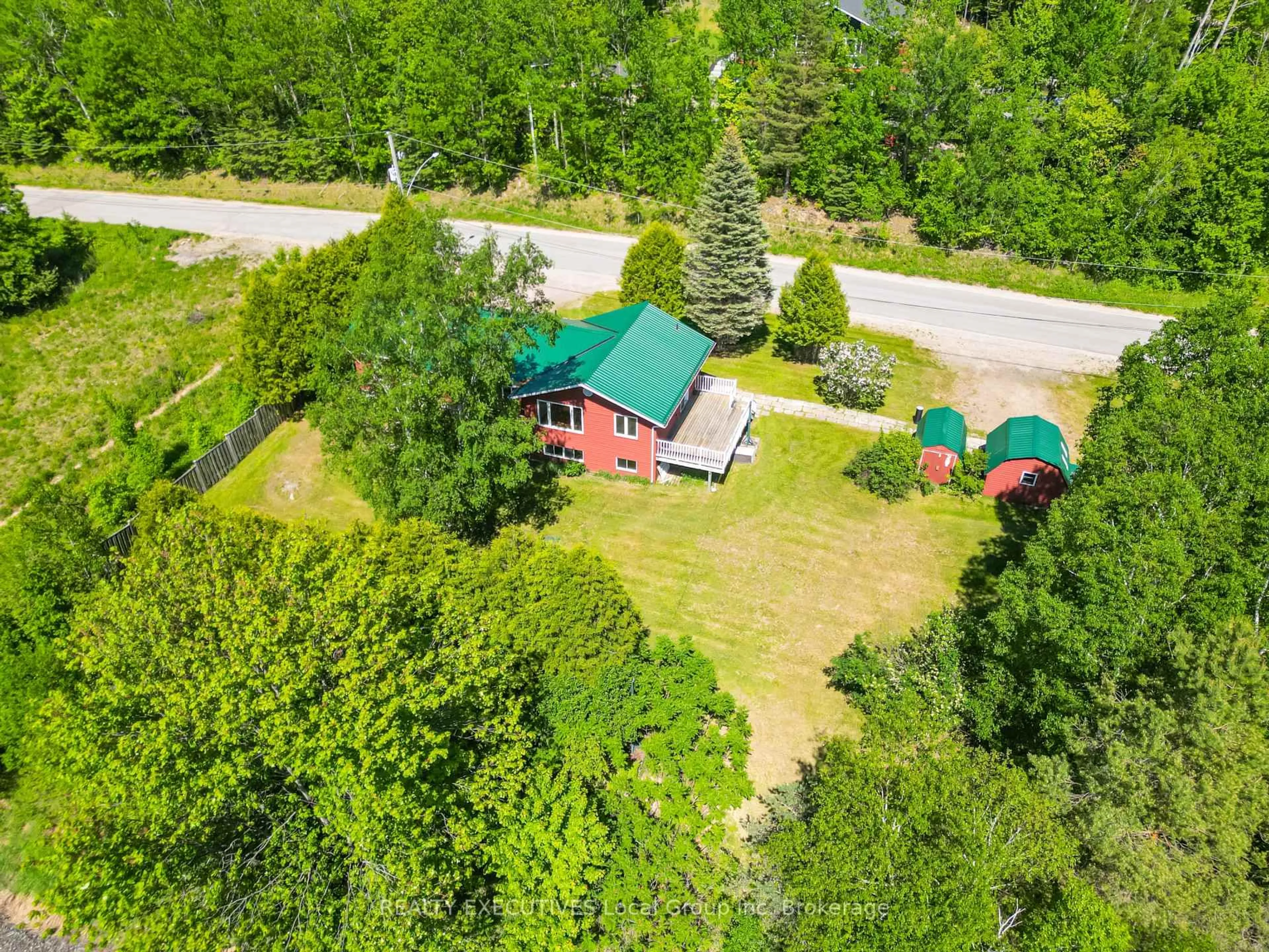 A pic from outside/outdoor area/front of a property/back of a property/a pic from drone, forest/trees view for 153 Big Bend Ave, Powassan Ontario P0H 1Z0