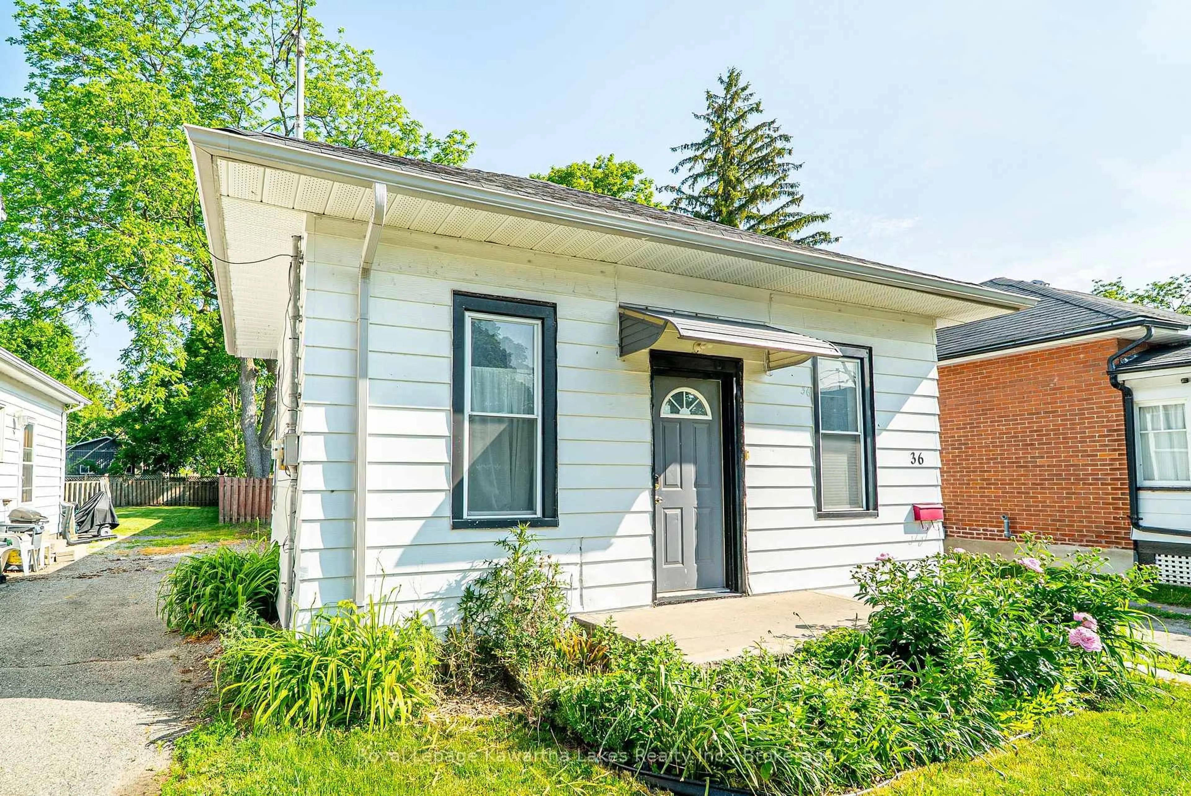 Home with vinyl exterior material, street for 36 Melbourne St, Kawartha Lakes Ontario K9V 2S8