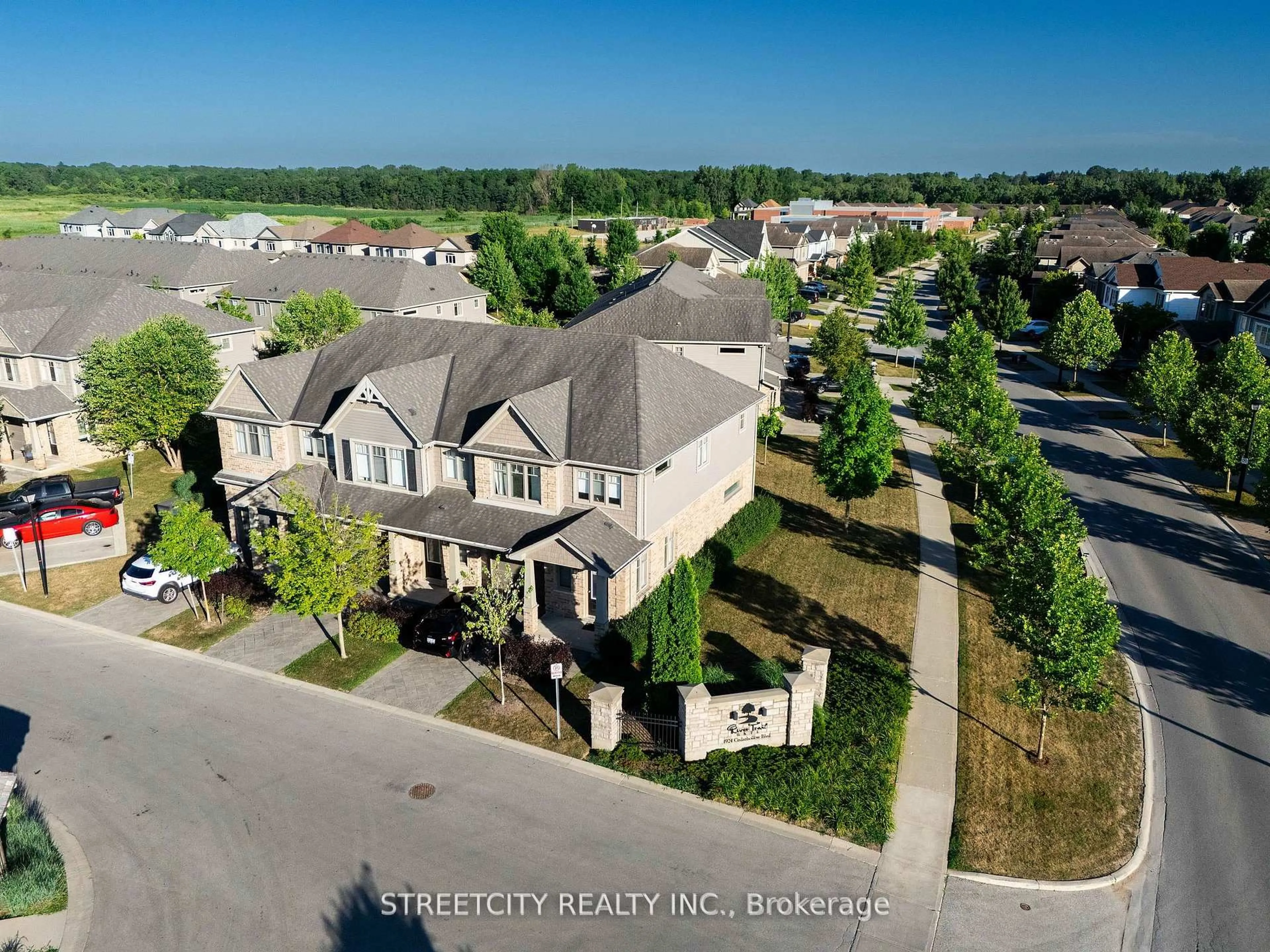 A pic from outside/outdoor area/front of a property/back of a property/a pic from drone, street for 1924 Cedarhollow Blvd #3, London North Ontario N5X 0K3
