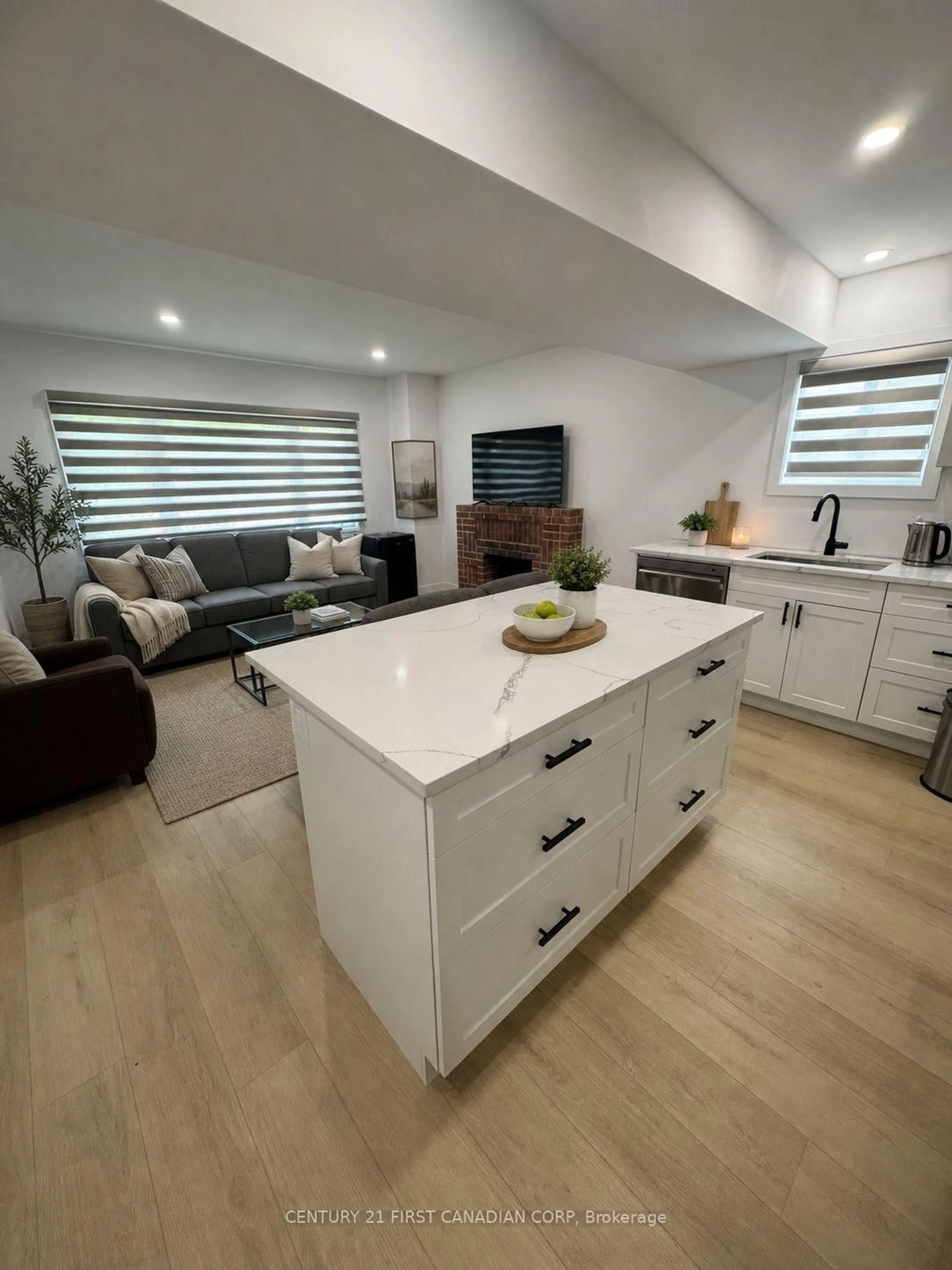 Open concept kitchen, wood/laminate floor for 128 Empress Ave, London North Ontario N6H 1N3