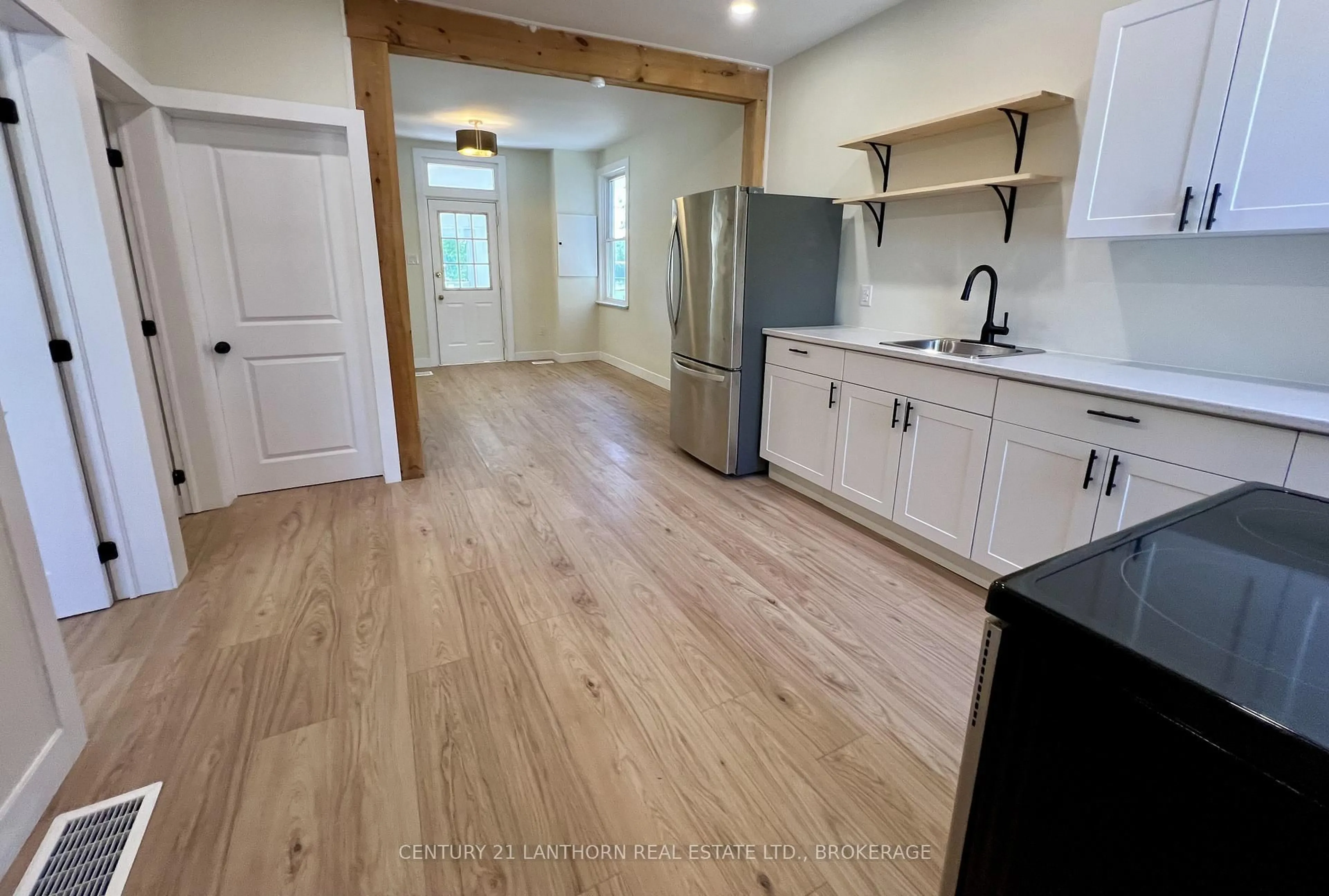 Open concept kitchen, wood/laminate floor for 418 Montreal St, Kingston Ontario K7K 3H7