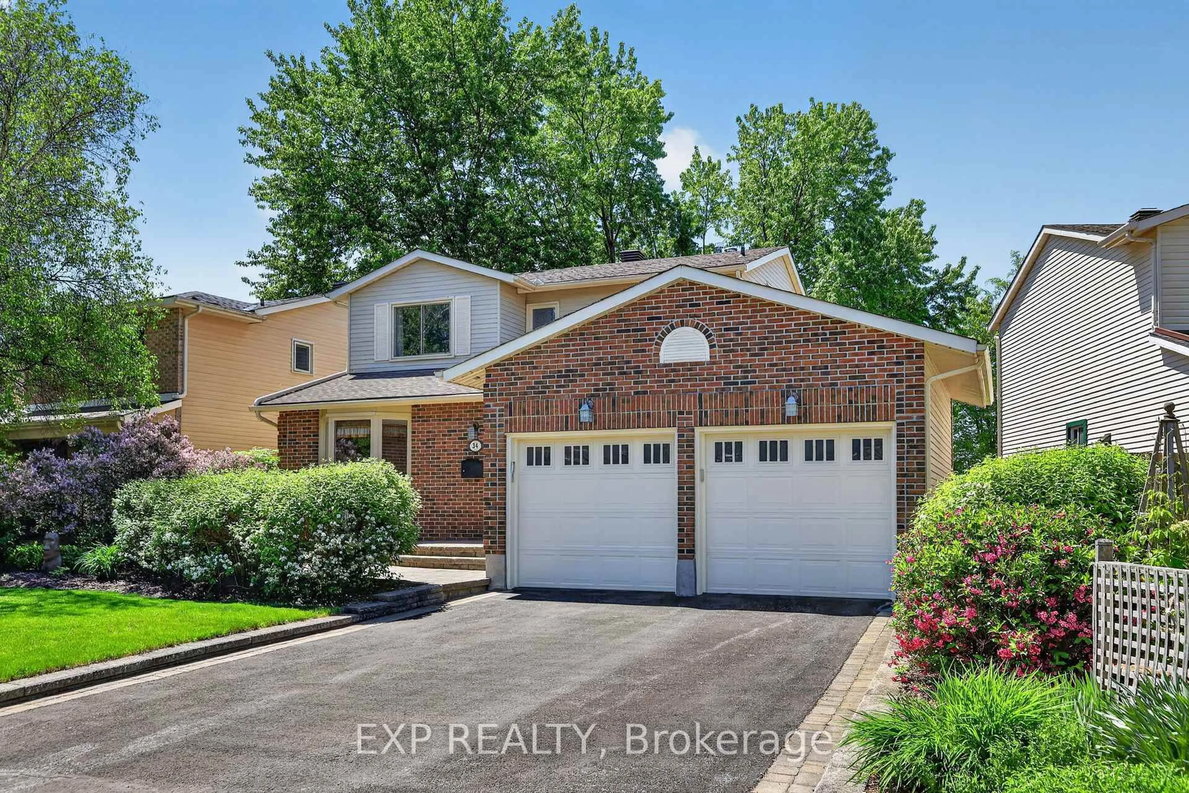 Home with brick exterior material, street for 34 Four Seasons Dr, Ottawa Ontario K2E 7P8