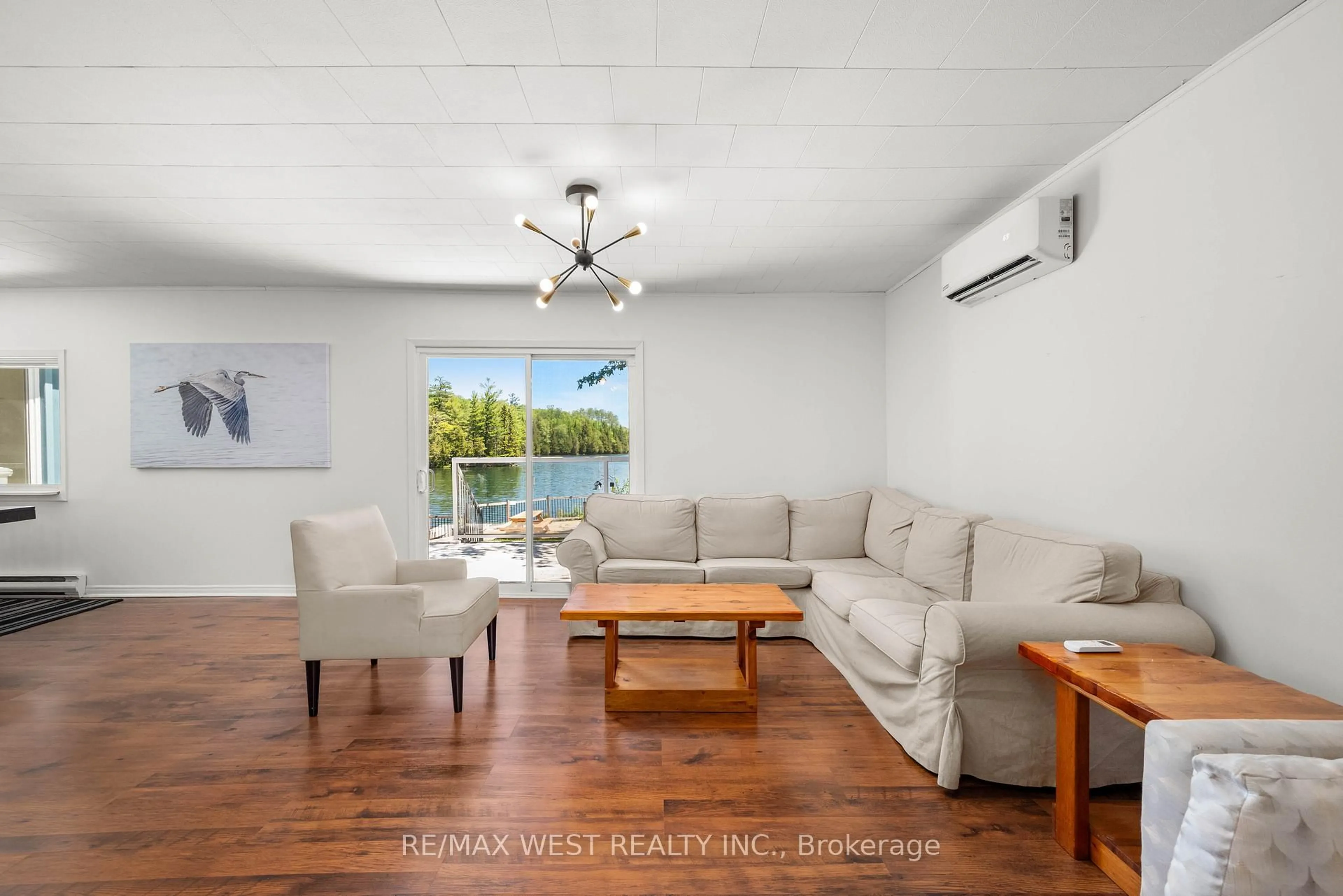 Living room with furniture, wood/laminate floor for 1432 Clement Lake Rd, Highlands East Ontario K0L 3C0