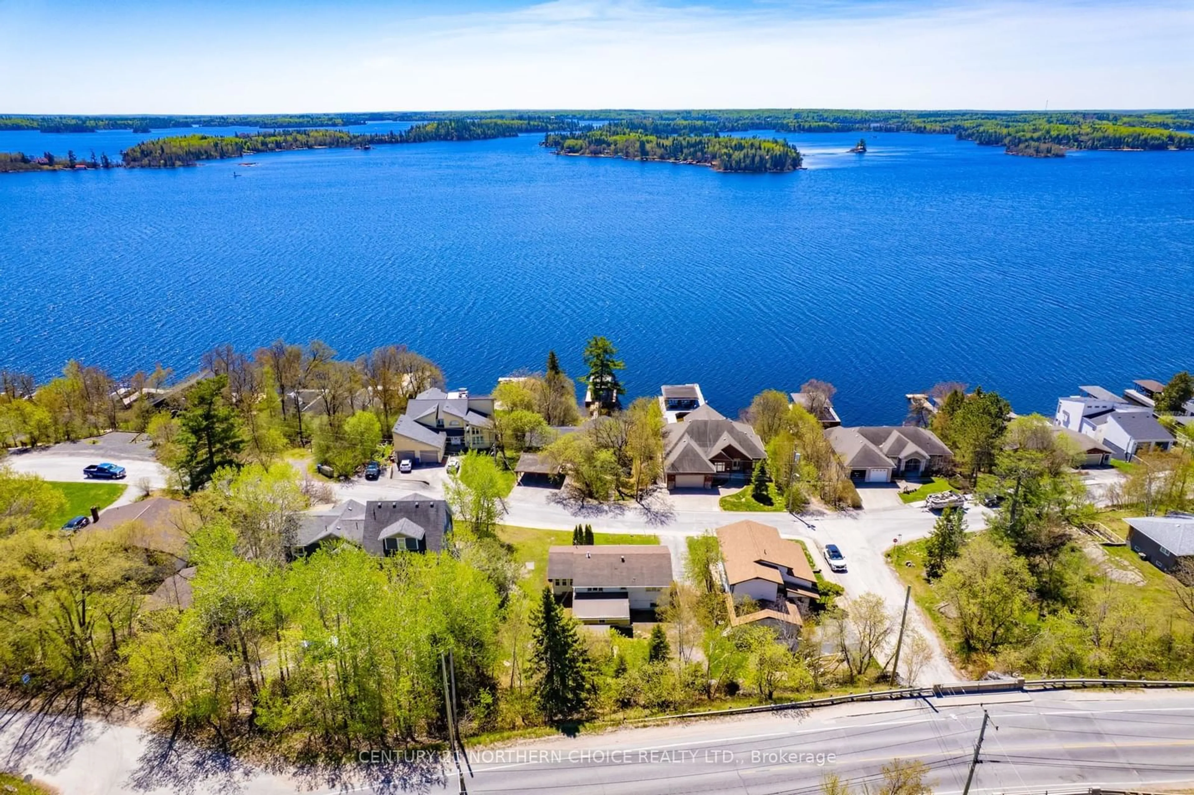 A pic from outside/outdoor area/front of a property/back of a property/a pic from drone, water/lake/river/ocean view for 504 Beach Road, Kenora Ontario P0X 1C0