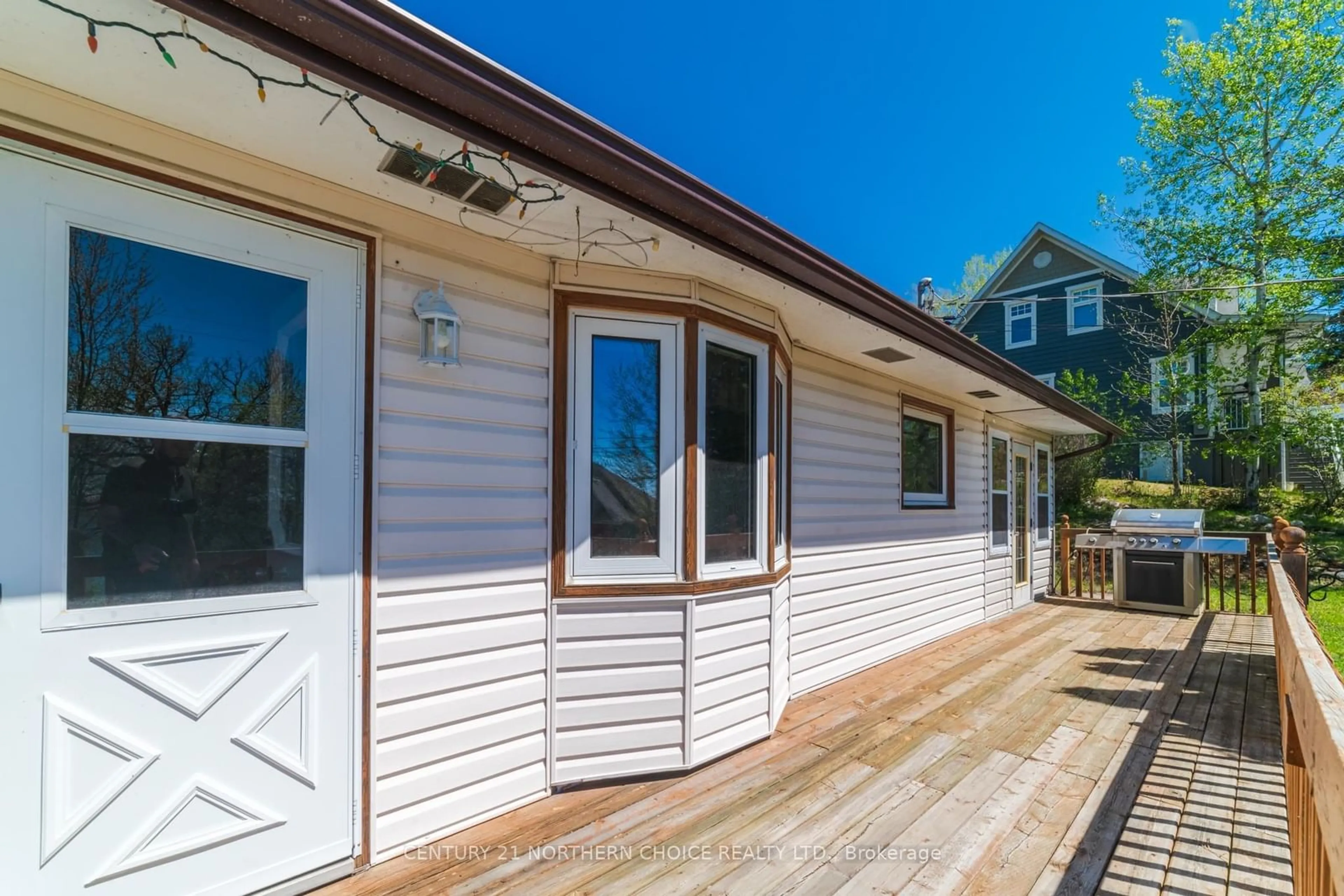 Home with vinyl exterior material, street for 504 Beach Road, Kenora Ontario P0X 1C0