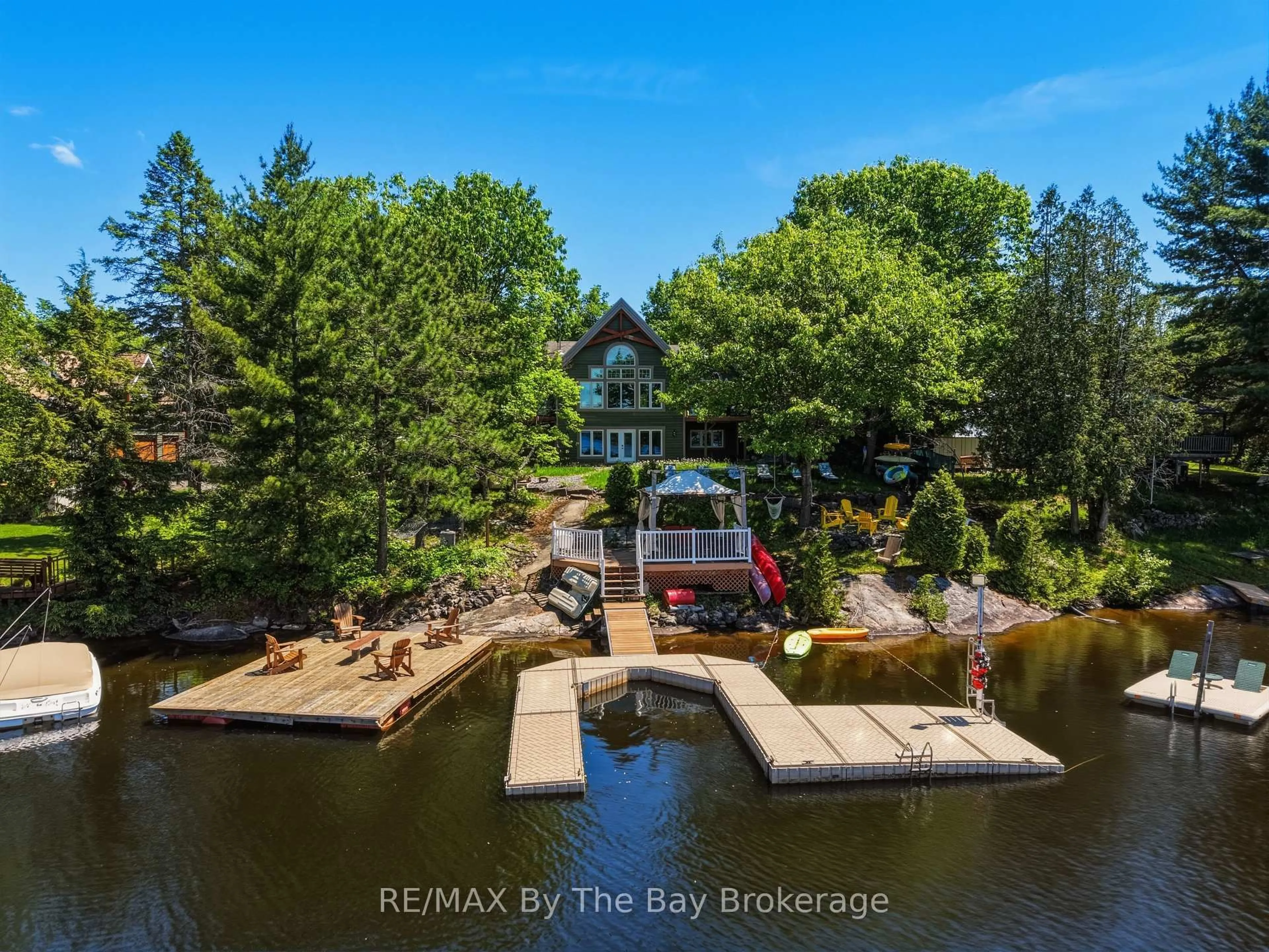 A pic from outside/outdoor area/front of a property/back of a property/a pic from drone, water/lake/river/ocean view for 61 Mckellar Lake Rd, McKellar Ontario P0G 1C0