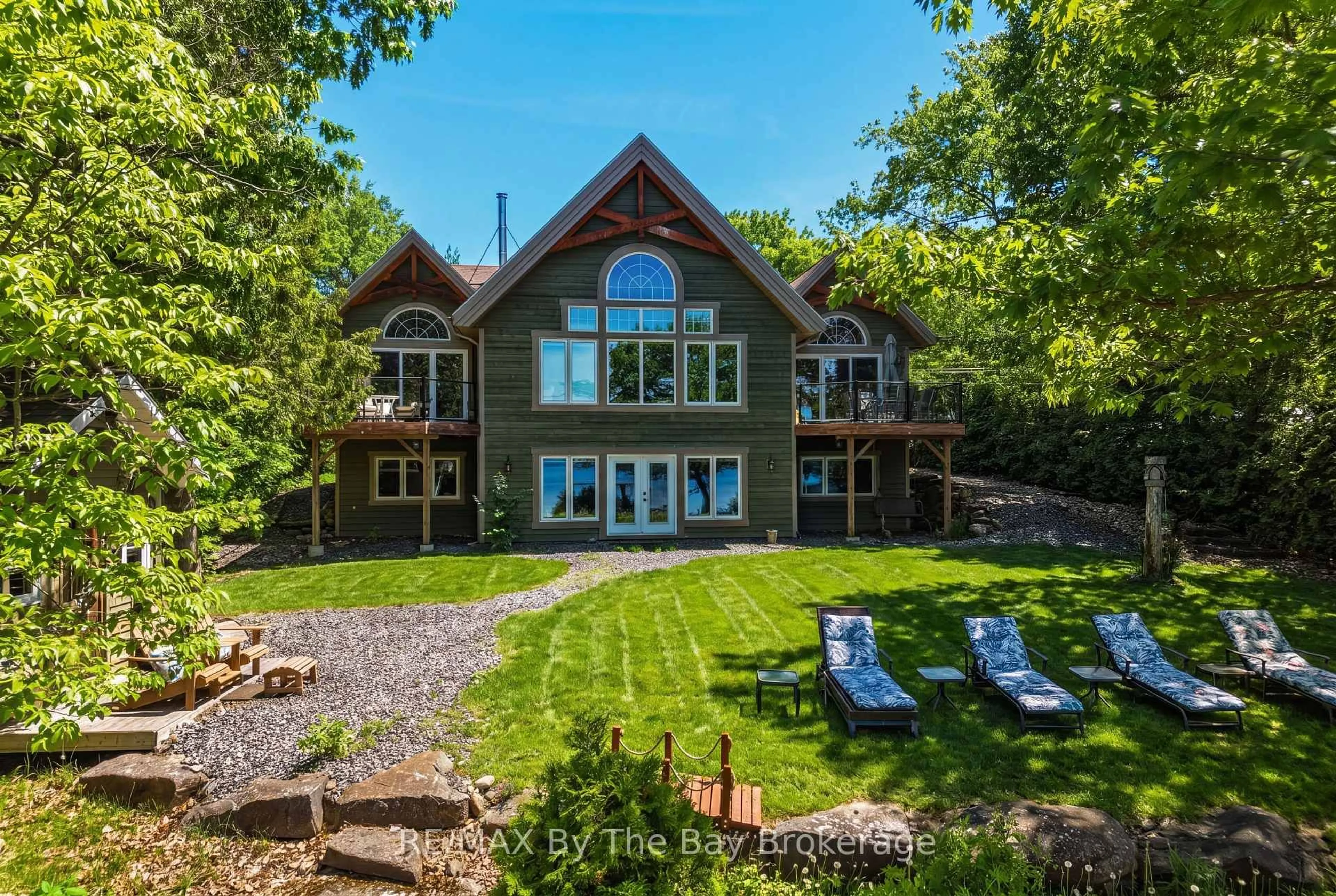 A pic from outside/outdoor area/front of a property/back of a property/a pic from drone, water/lake/river/ocean view for 61 Mckellar Lake Rd, McKellar Ontario P0G 1C0