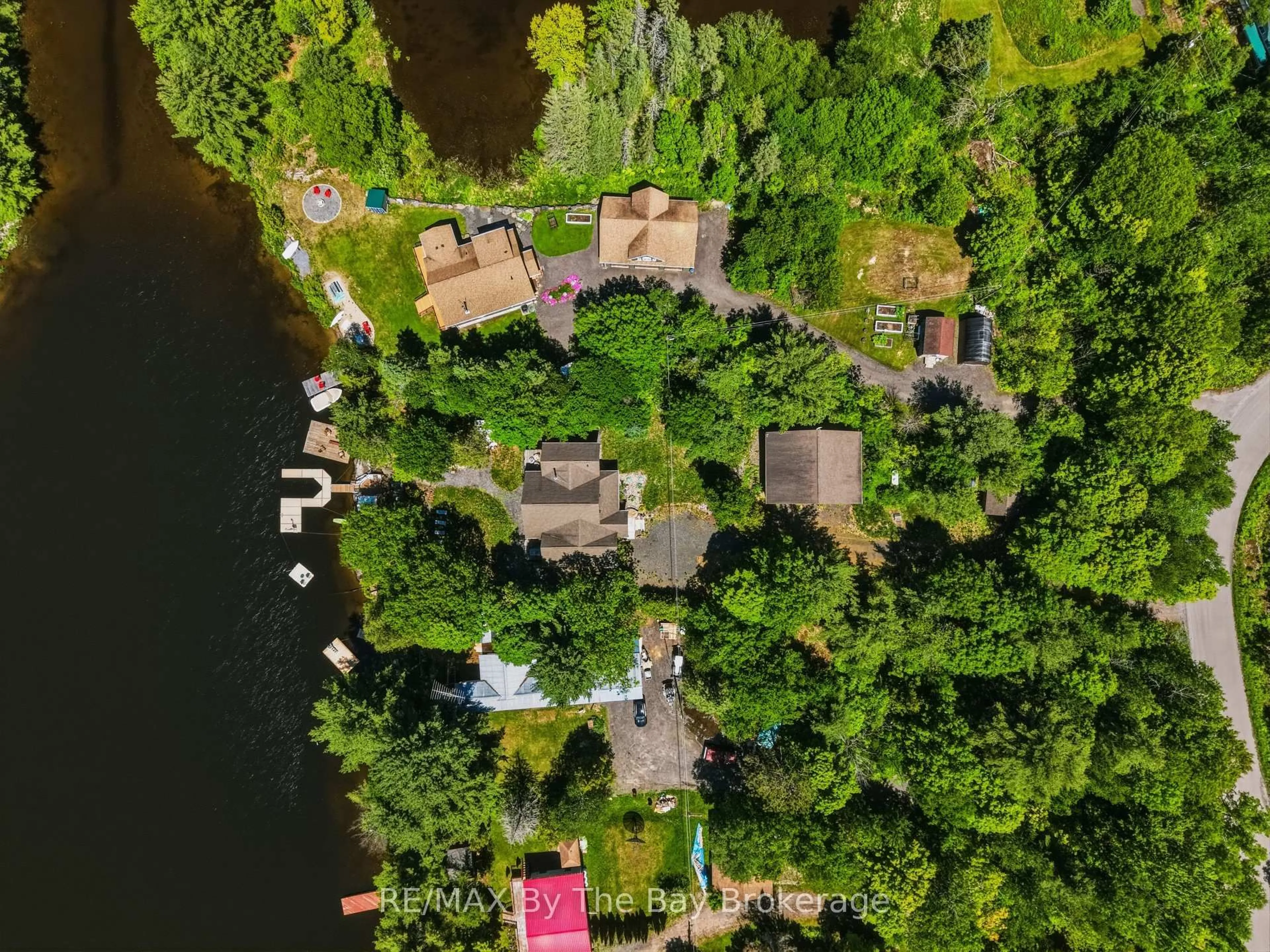A pic from outside/outdoor area/front of a property/back of a property/a pic from drone, water/lake/river/ocean view for 61 Mckellar Lake Rd, McKellar Ontario P0G 1C0