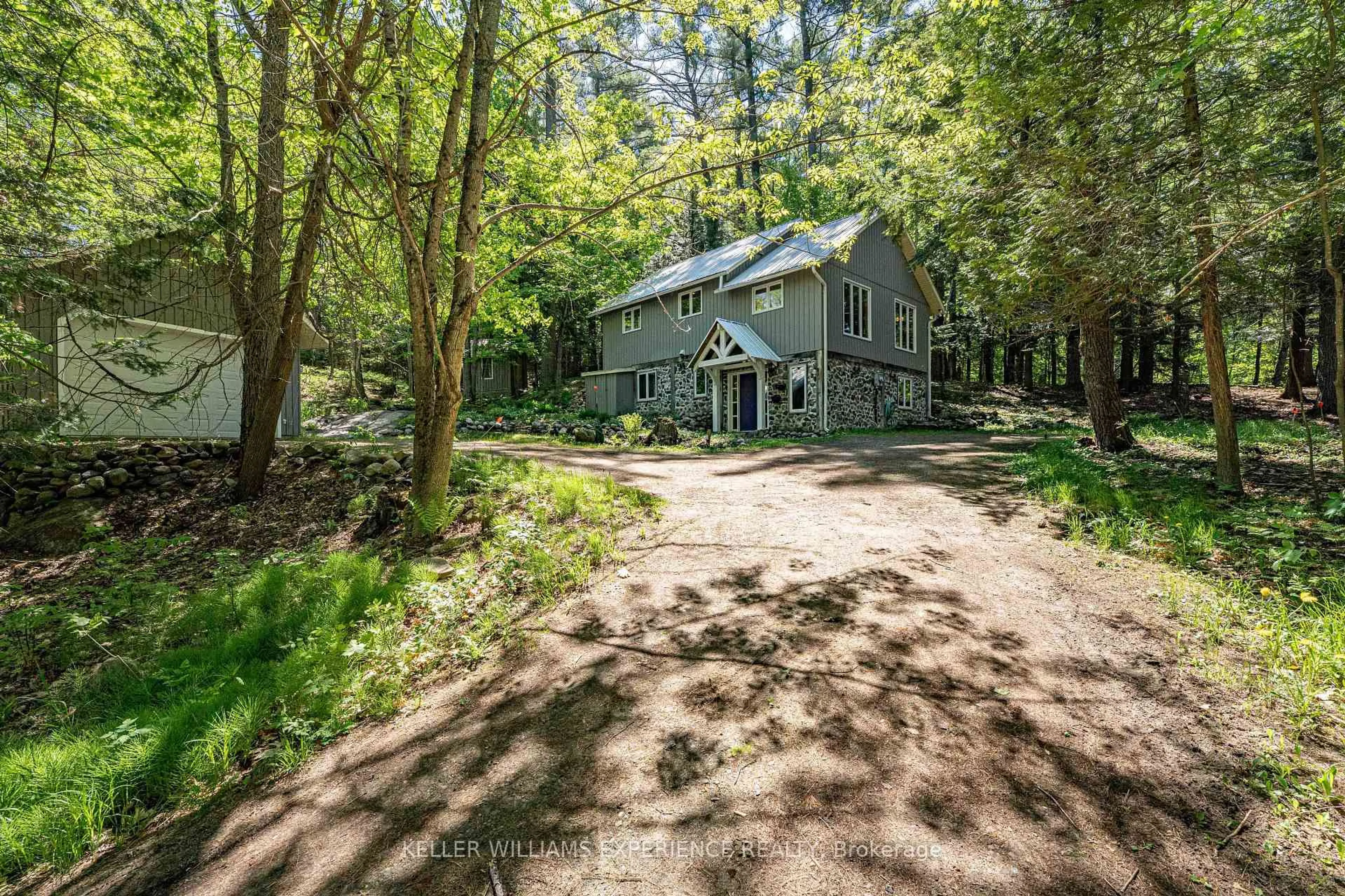 A pic from outside/outdoor area/front of a property/back of a property/a pic from drone, forest/trees view for 55 Mary Lake Cres, Huntsville Ontario P0B 1L0