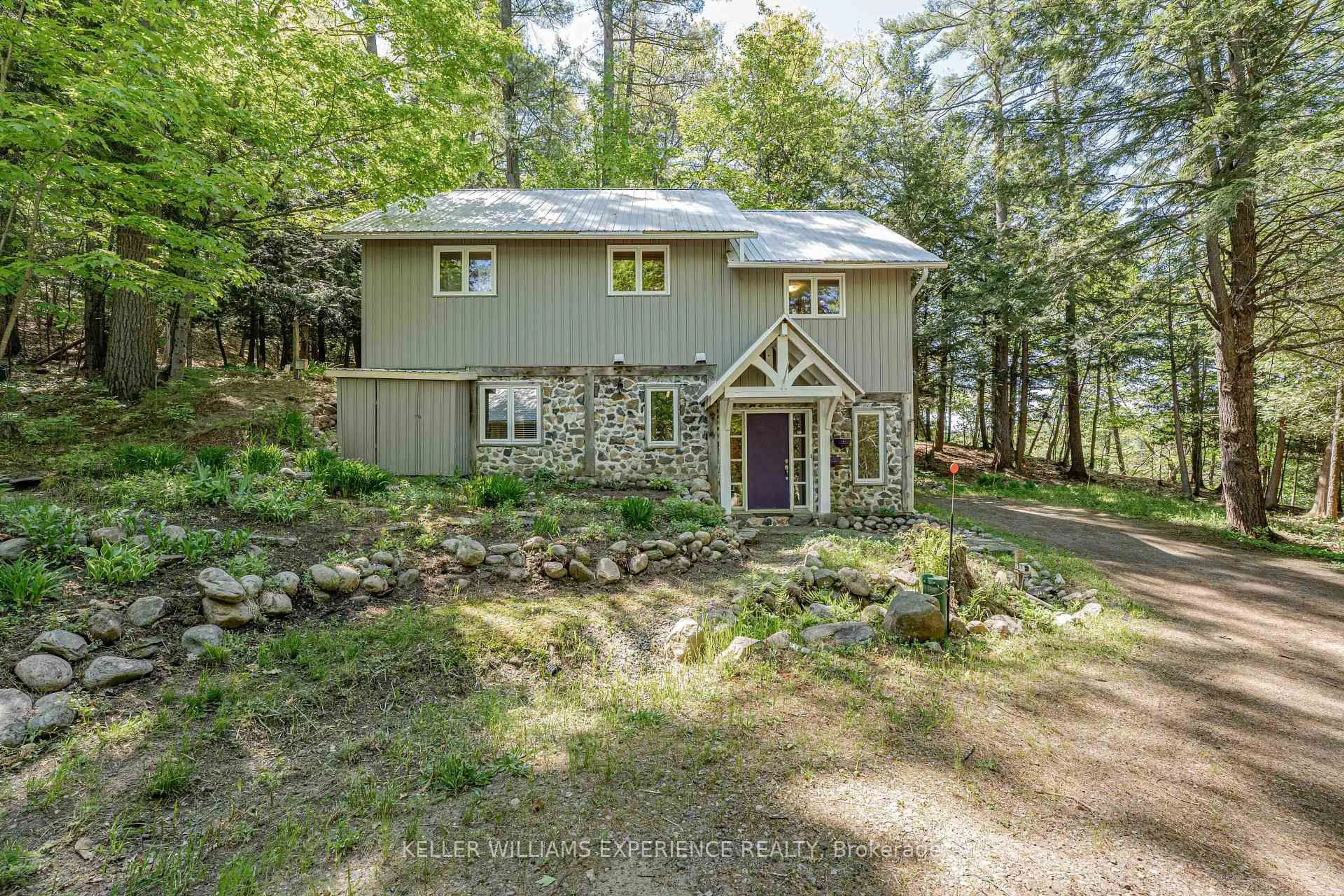 A pic from outside/outdoor area/front of a property/back of a property/a pic from drone, forest/trees view for 55 Mary Lake Cres, Huntsville Ontario P0B 1L0
