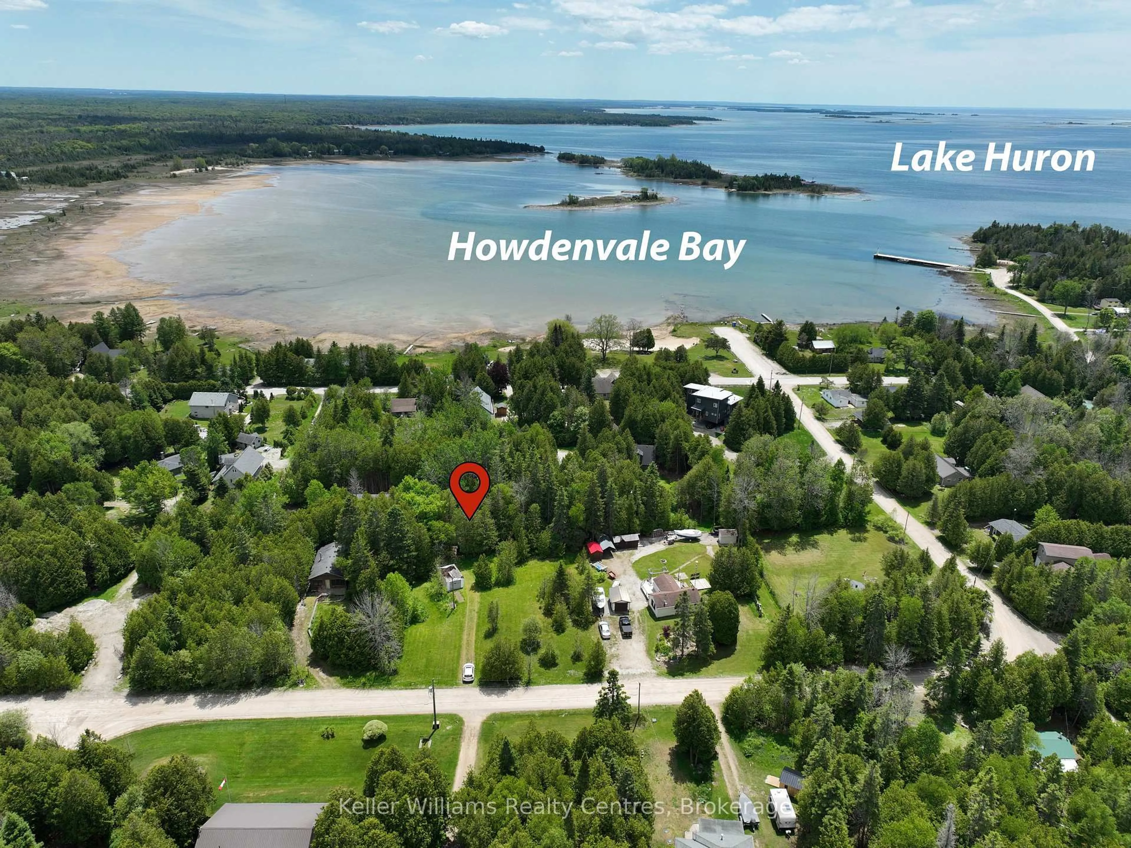 A pic from outside/outdoor area/front of a property/back of a property/a pic from drone, water/lake/river/ocean view for 12 Isabella St, South Bruce Peninsula Ontario N0H 2T0