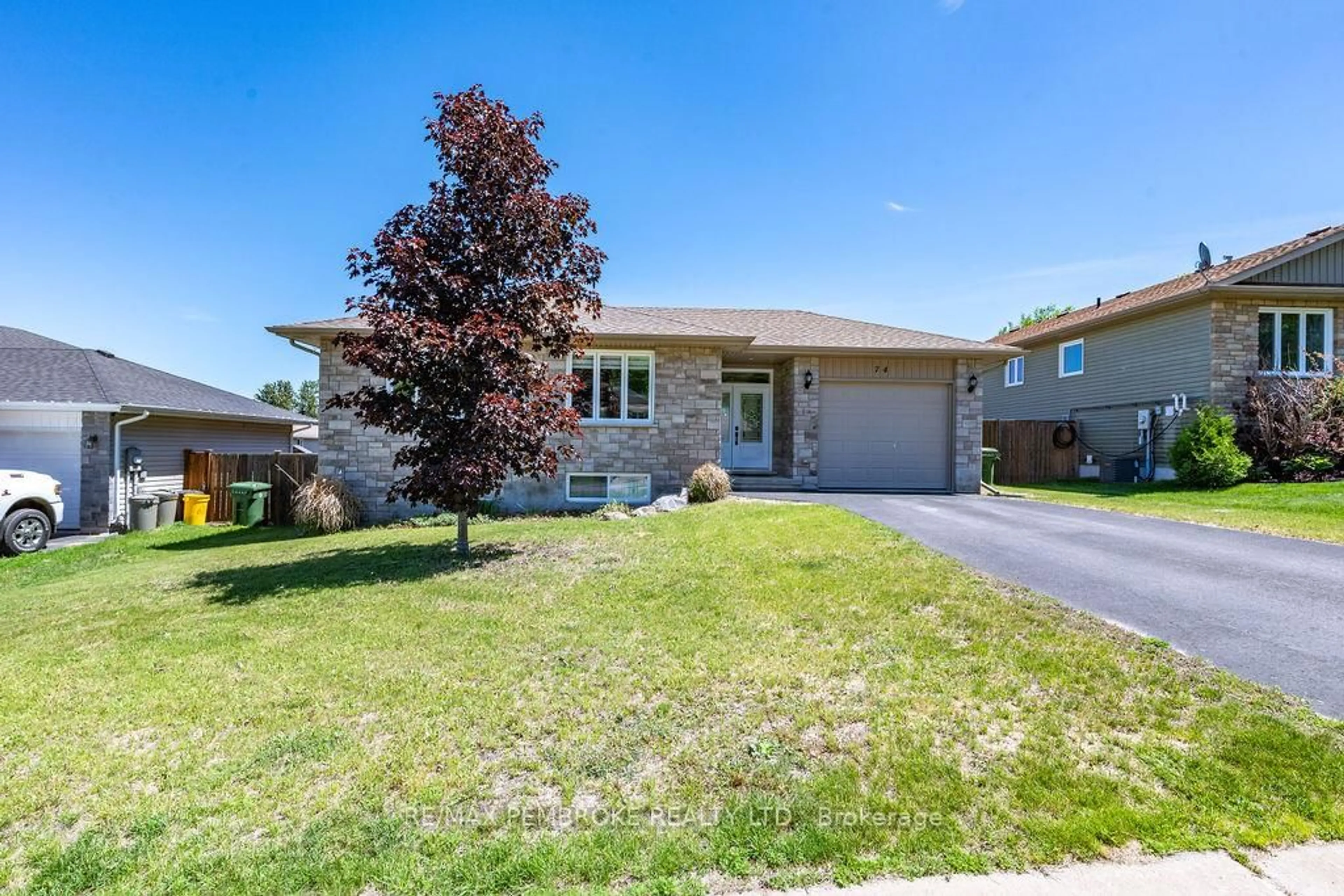 Home with brick exterior material, street for 74 Oak Ave, Petawawa Ontario K8H 0B5