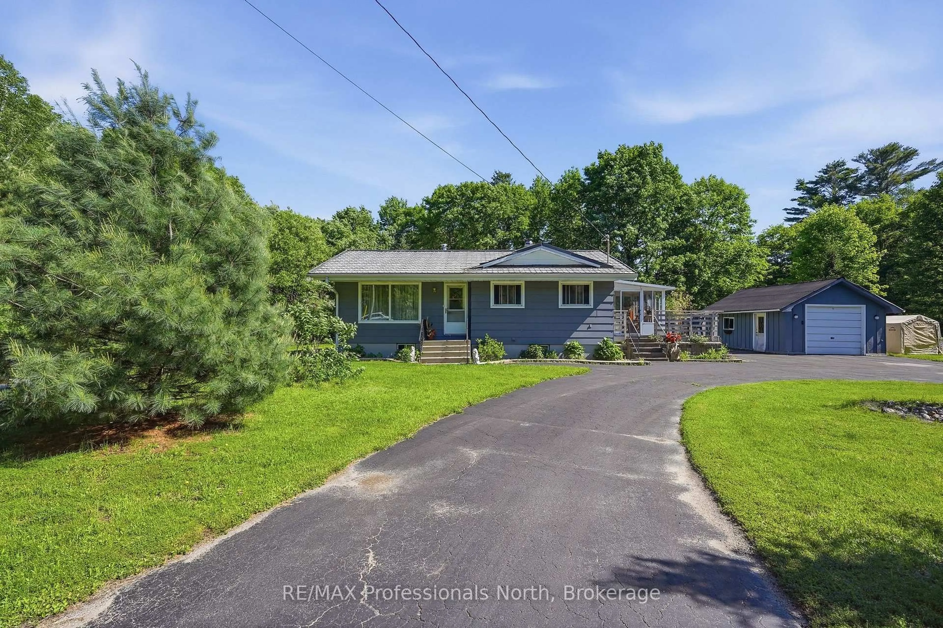 A pic from outside/outdoor area/front of a property/back of a property/a pic from drone, street for 329 Waseosa Lake Rd, Huntsville Ontario P1H 2J4