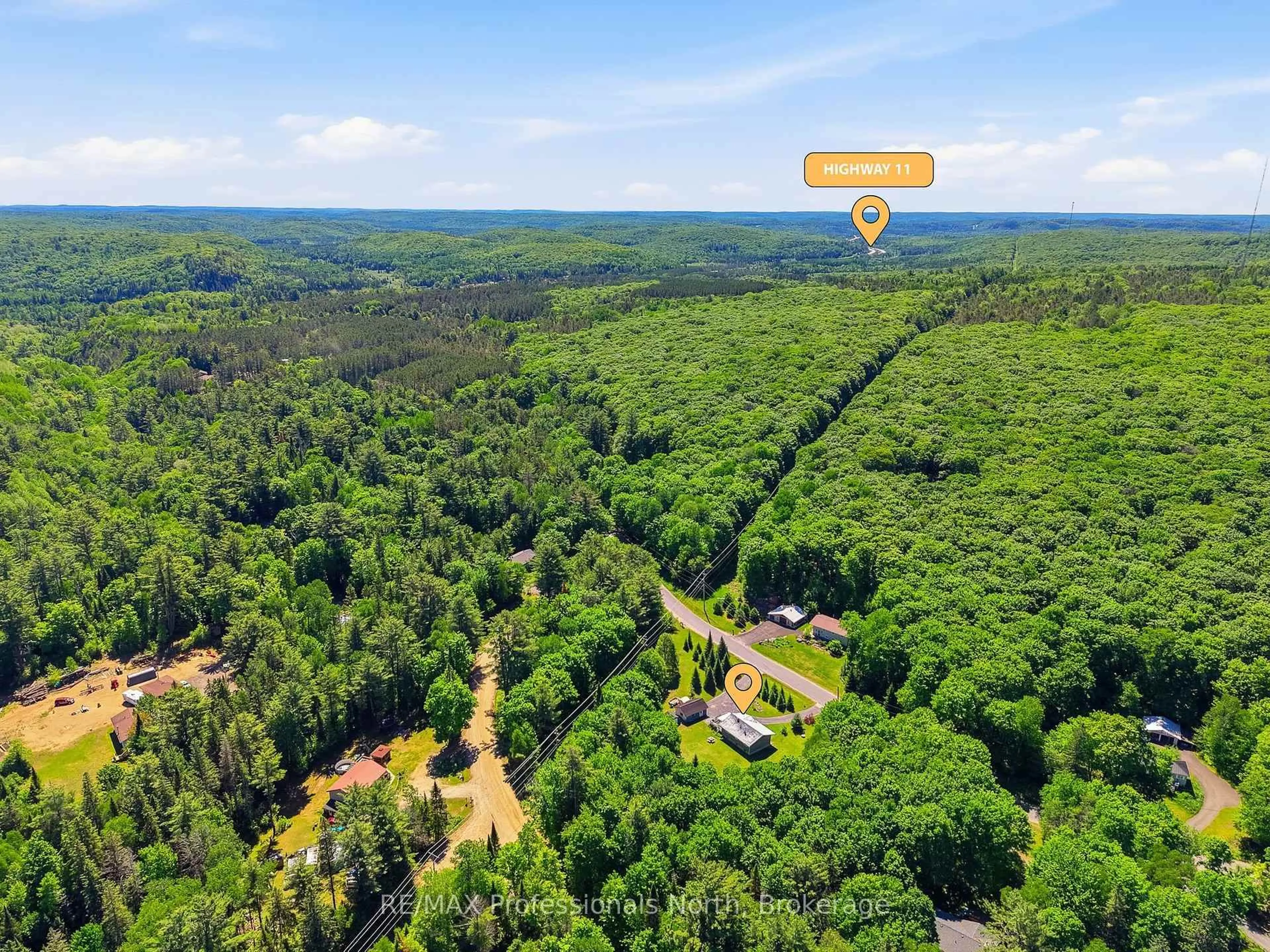 A pic from outside/outdoor area/front of a property/back of a property/a pic from drone, forest/trees view for 329 Waseosa Lake Rd, Huntsville Ontario P1H 2J4