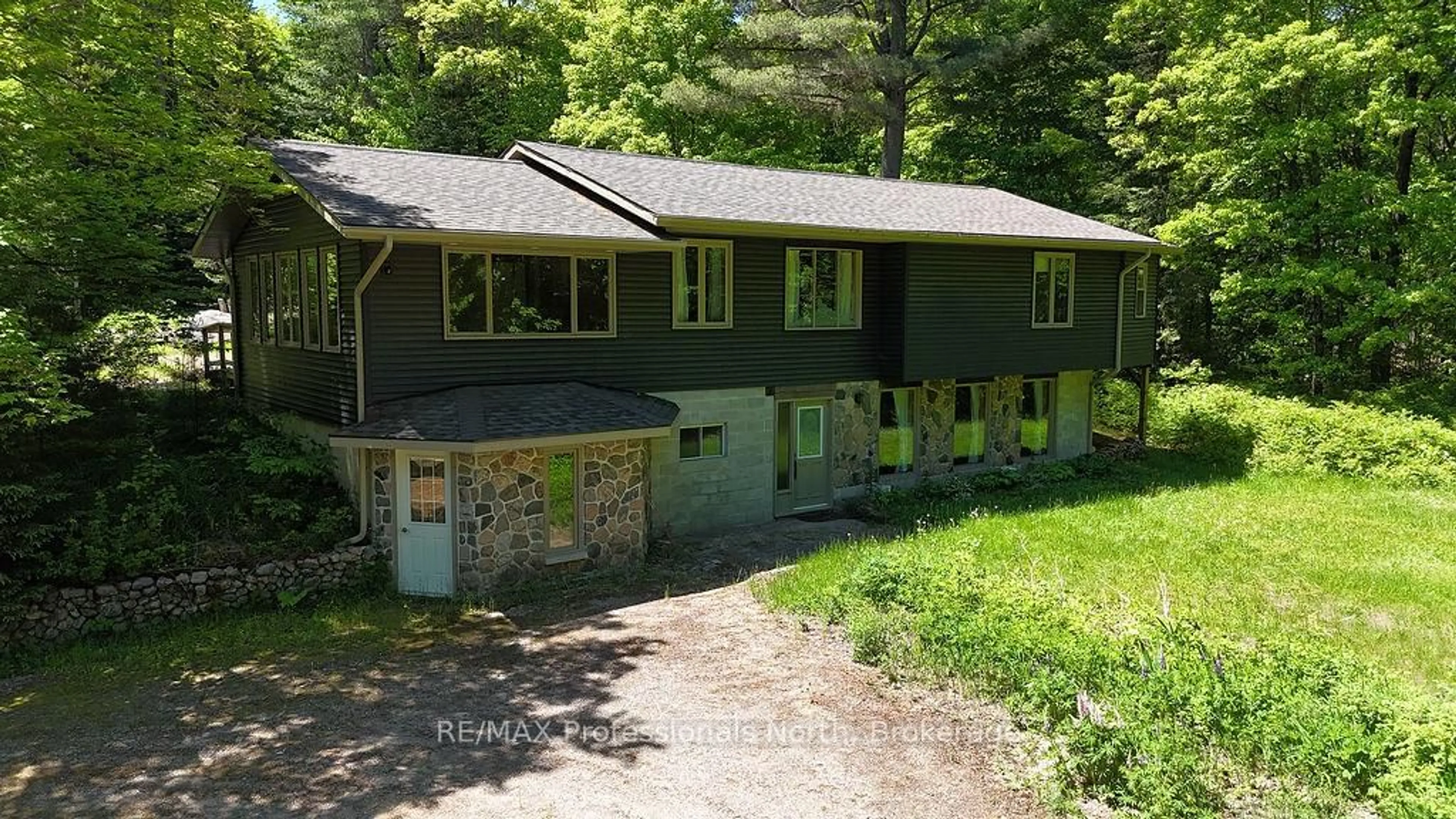A pic from outside/outdoor area/front of a property/back of a property/a pic from drone, unknown for 128 Old Muskoka Rd, Perry Ontario P0A 1J0